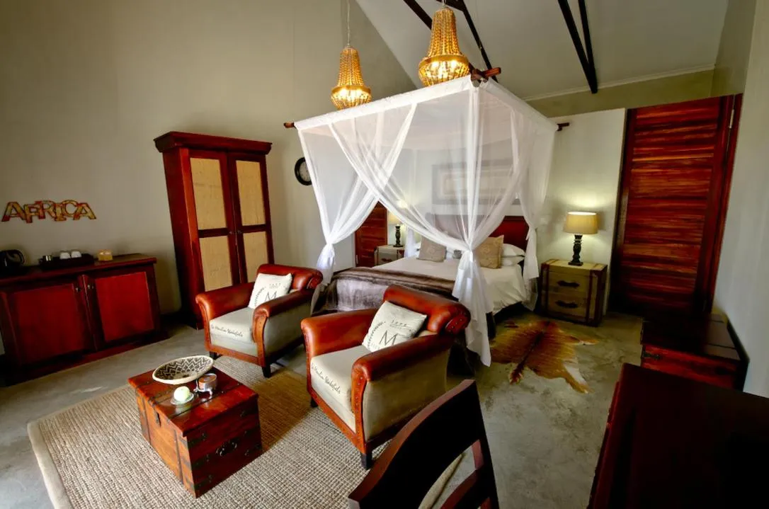 Seating area, Bed in Otjiwa Safari Lodge