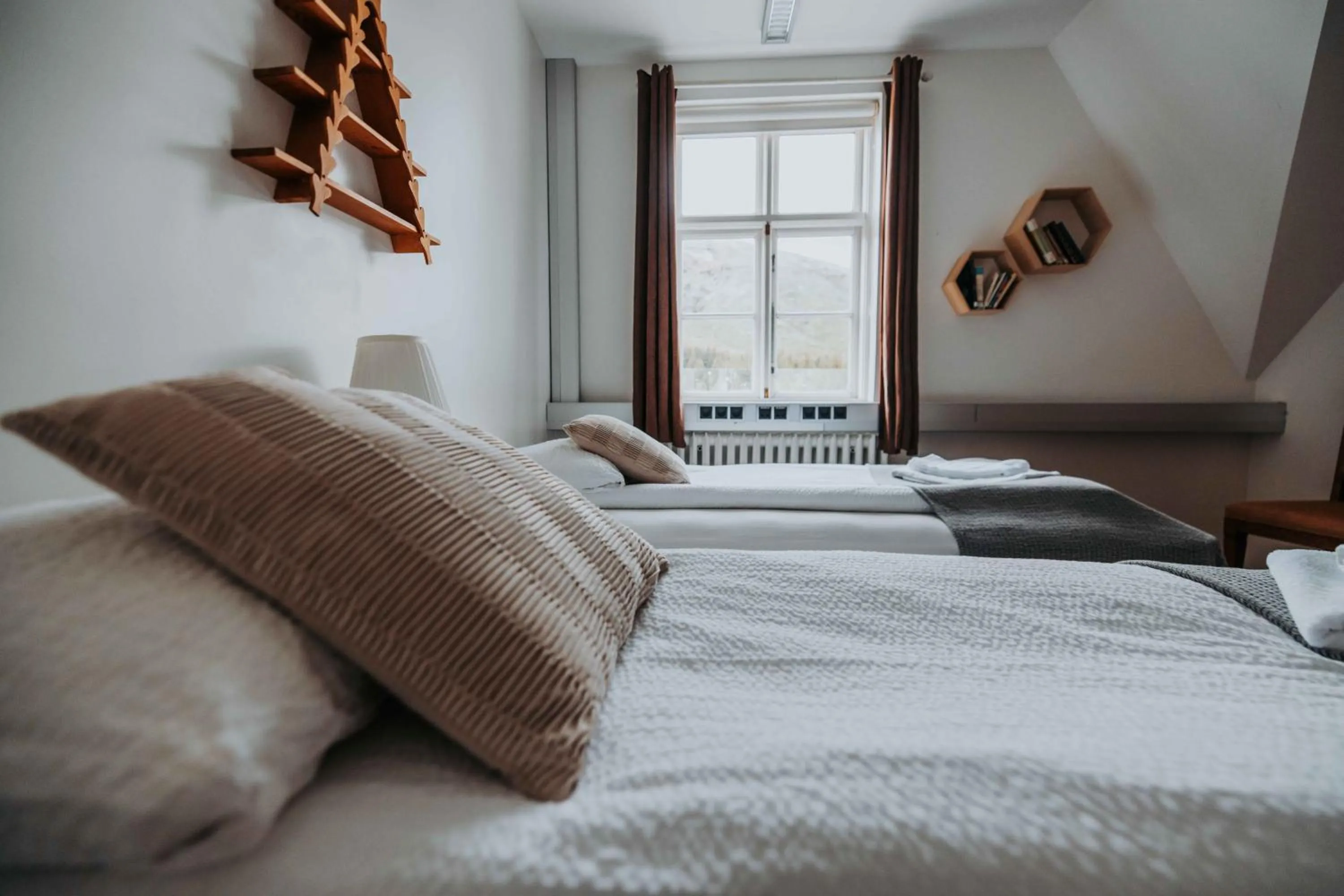 Bed in Héradsskólinn Historic Guesthouse