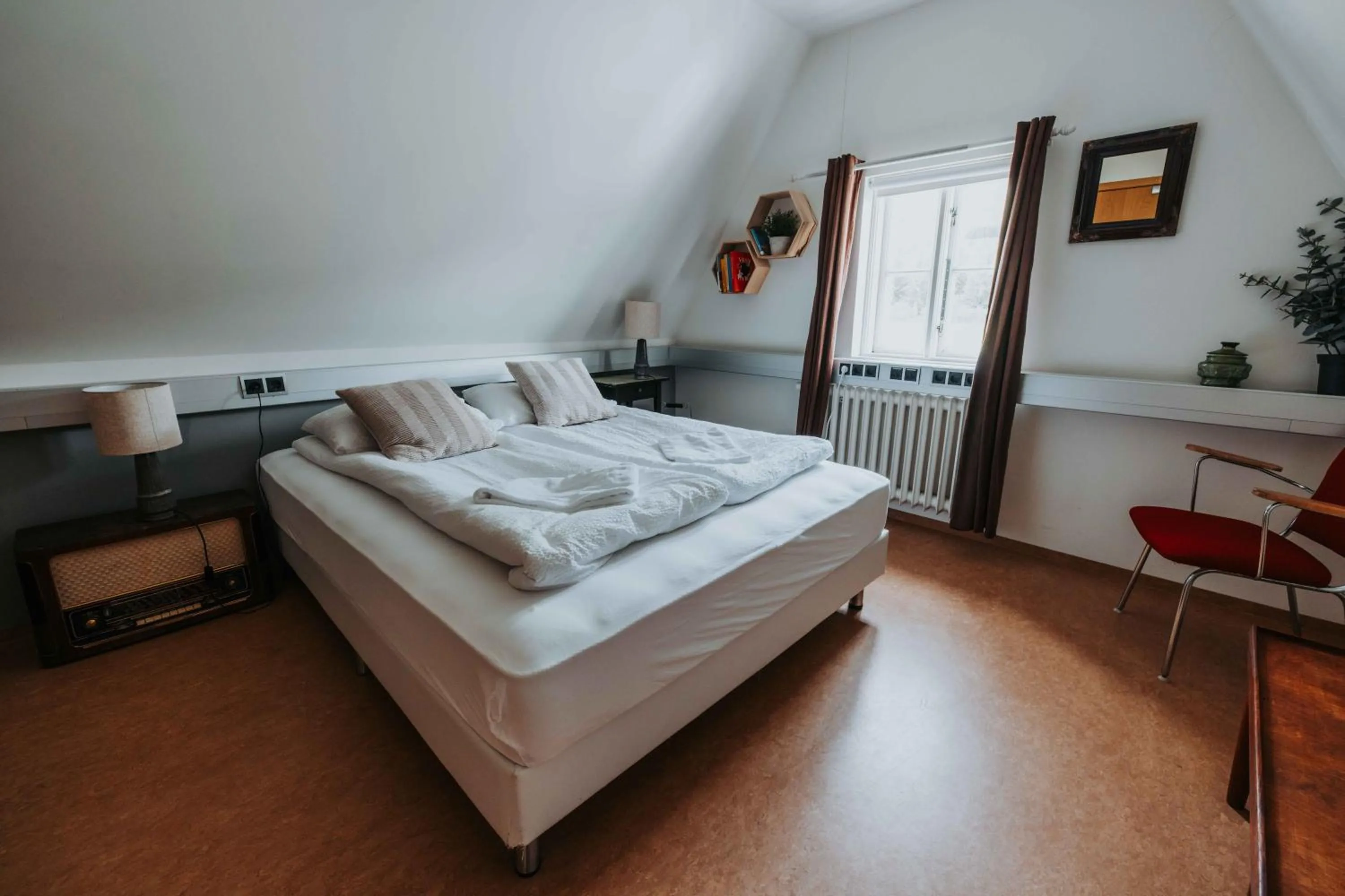 Bed in Héradsskólinn Historic Guesthouse