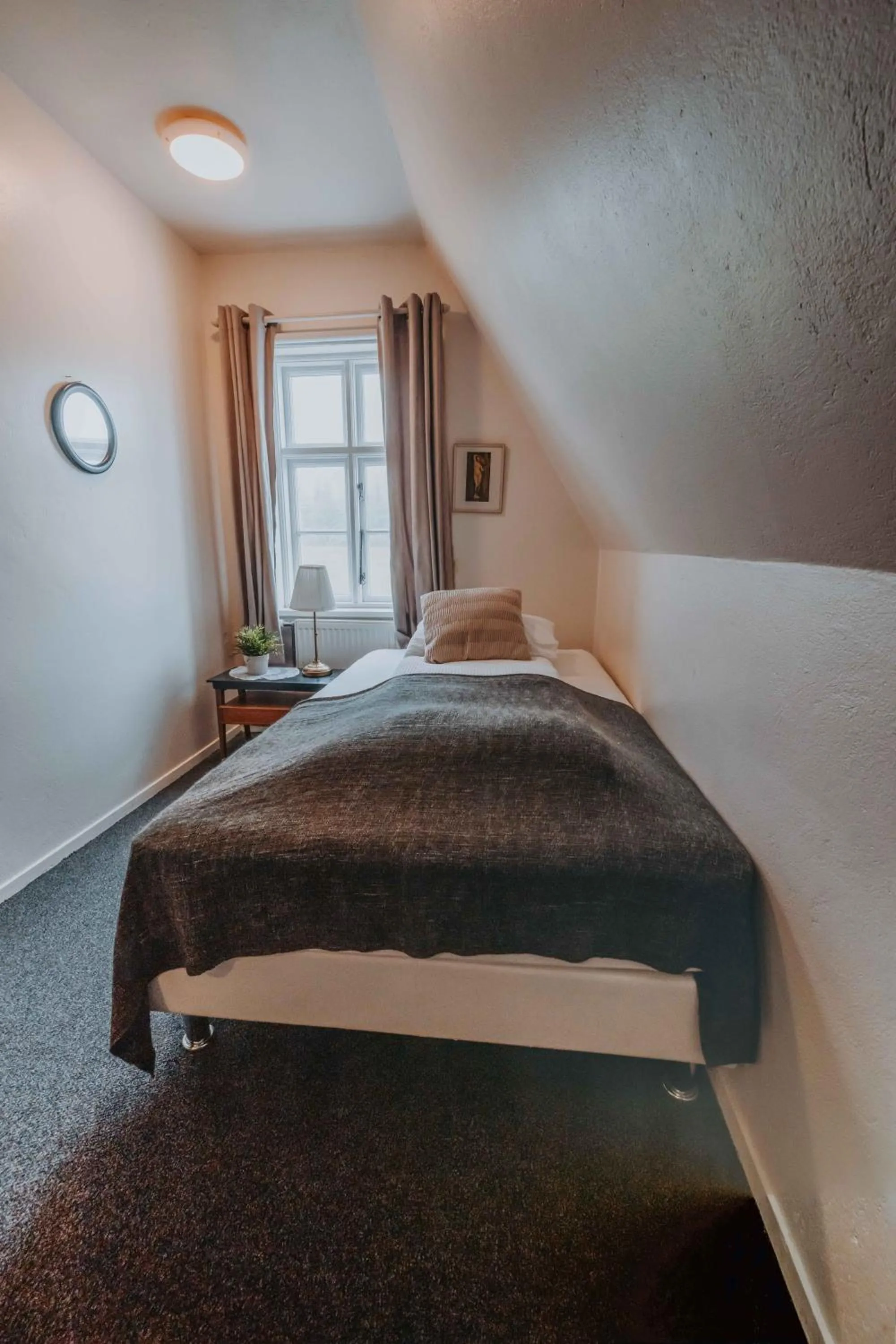 Bed in Héradsskólinn Historic Guesthouse