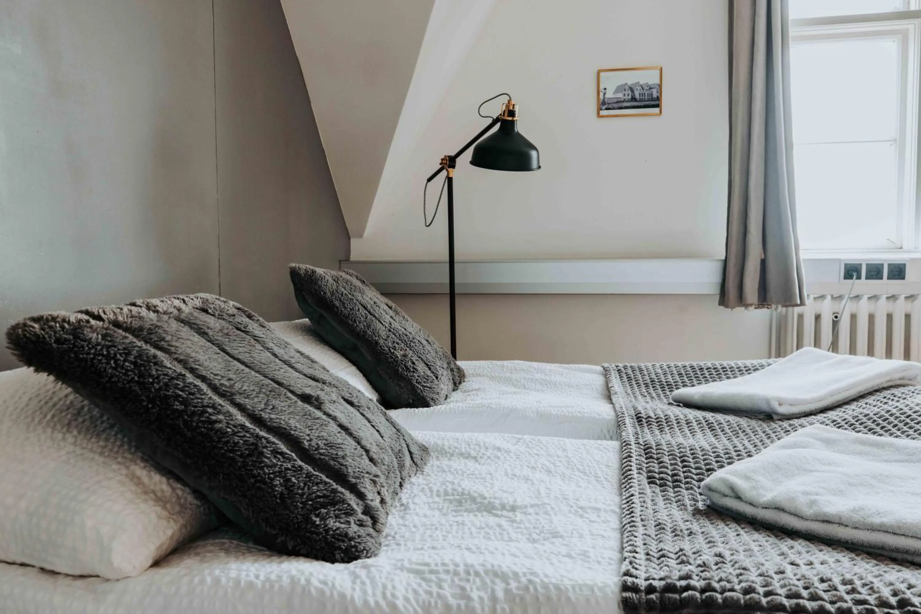 Bed in Héradsskólinn Historic Guesthouse