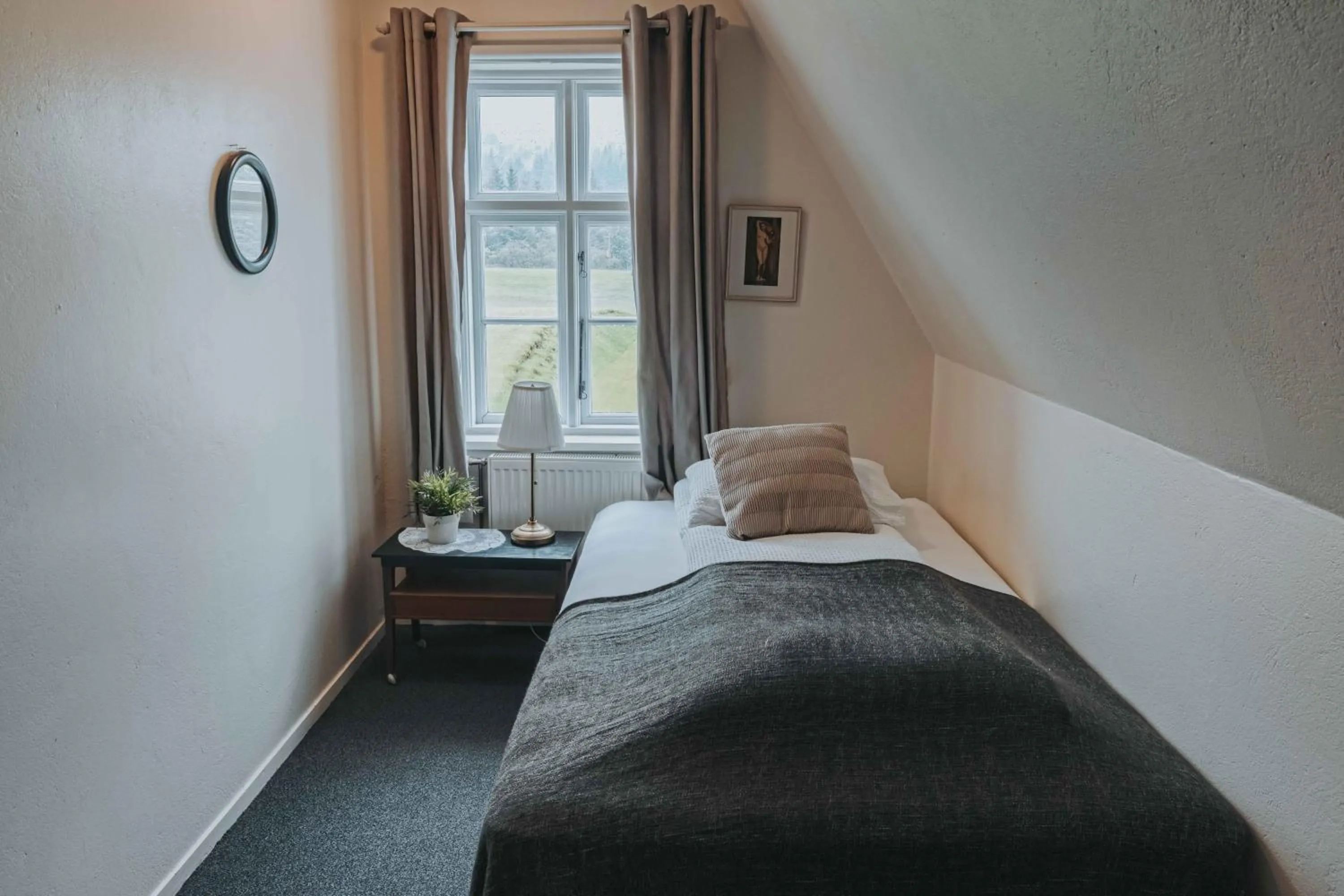 Bed in Héradsskólinn Historic Guesthouse