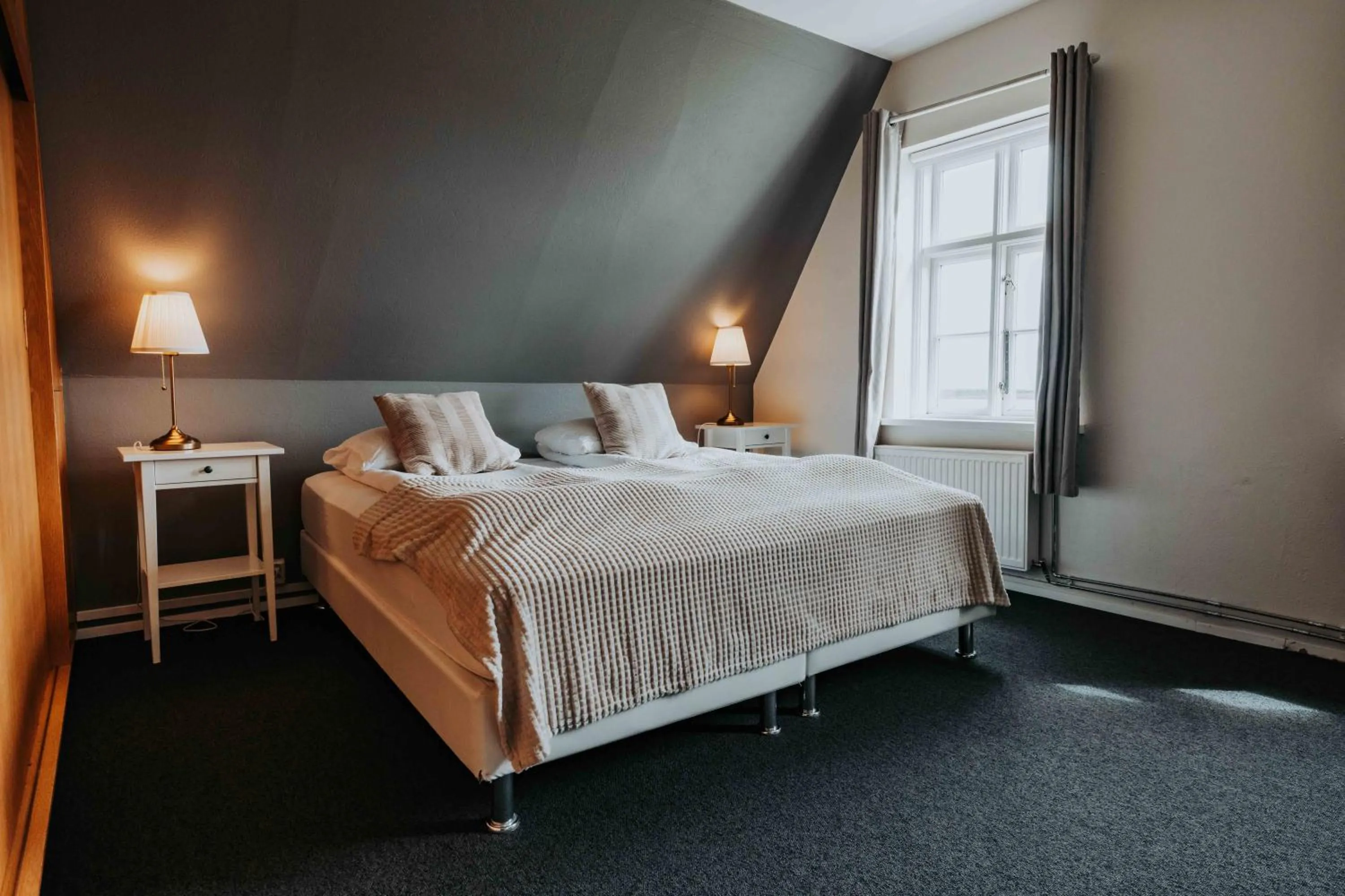 Bed in Héradsskólinn Historic Guesthouse