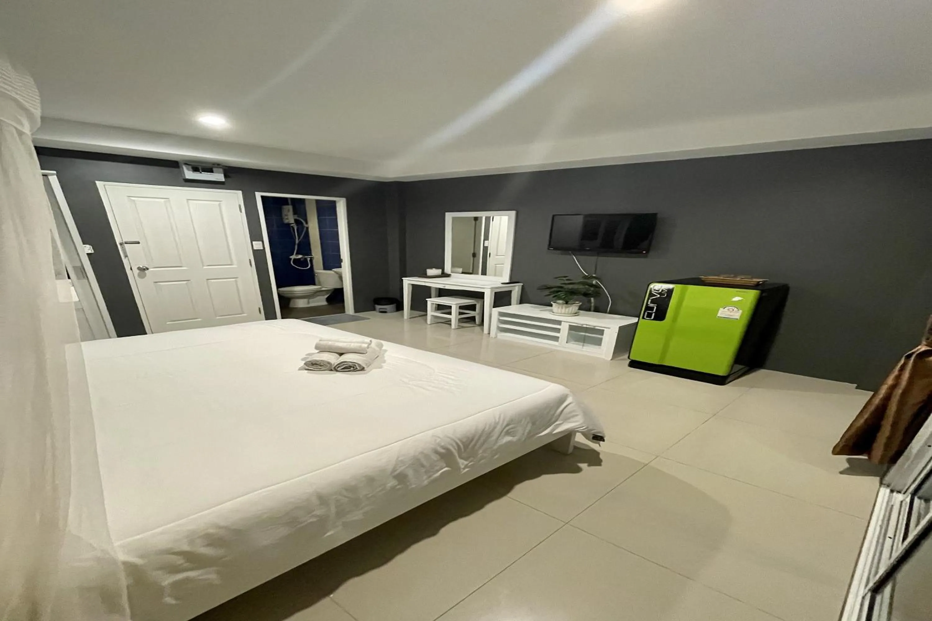 Bed in Be Rich Hotel