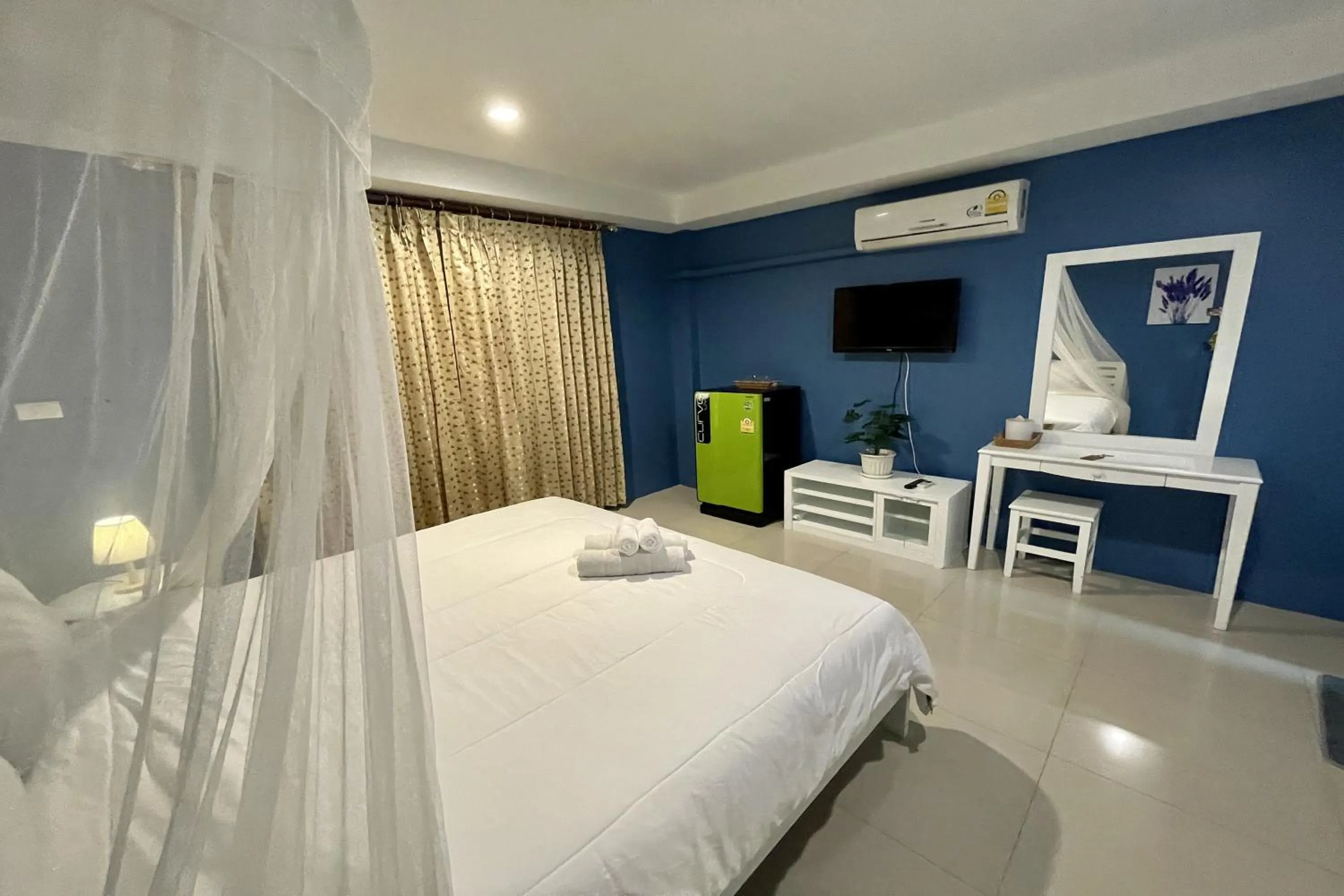 Bed in Be Rich Hotel