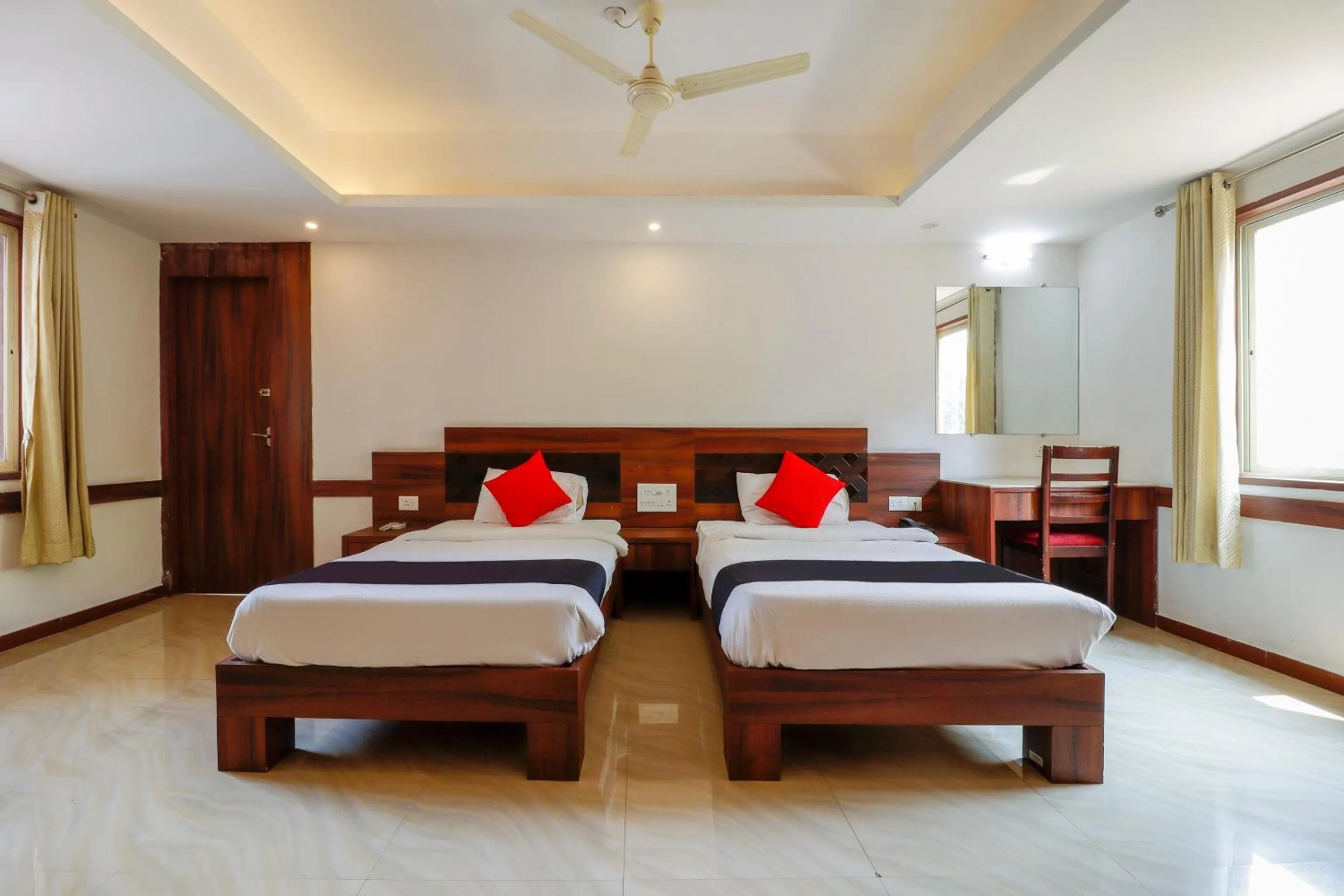 Bedroom, Bed in Capital O Sai Arya Residency