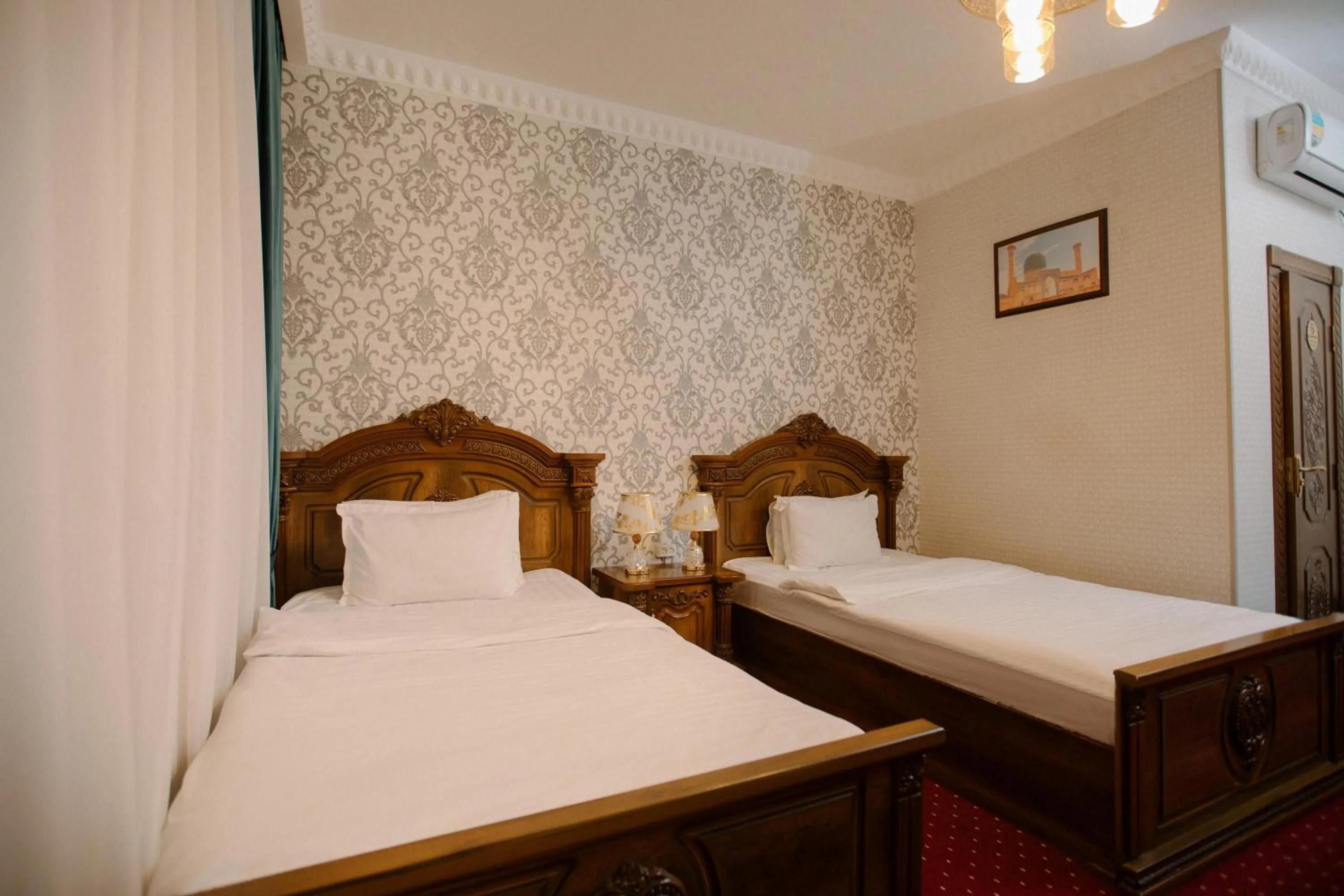 Bed in Dendi Plaza Hotel