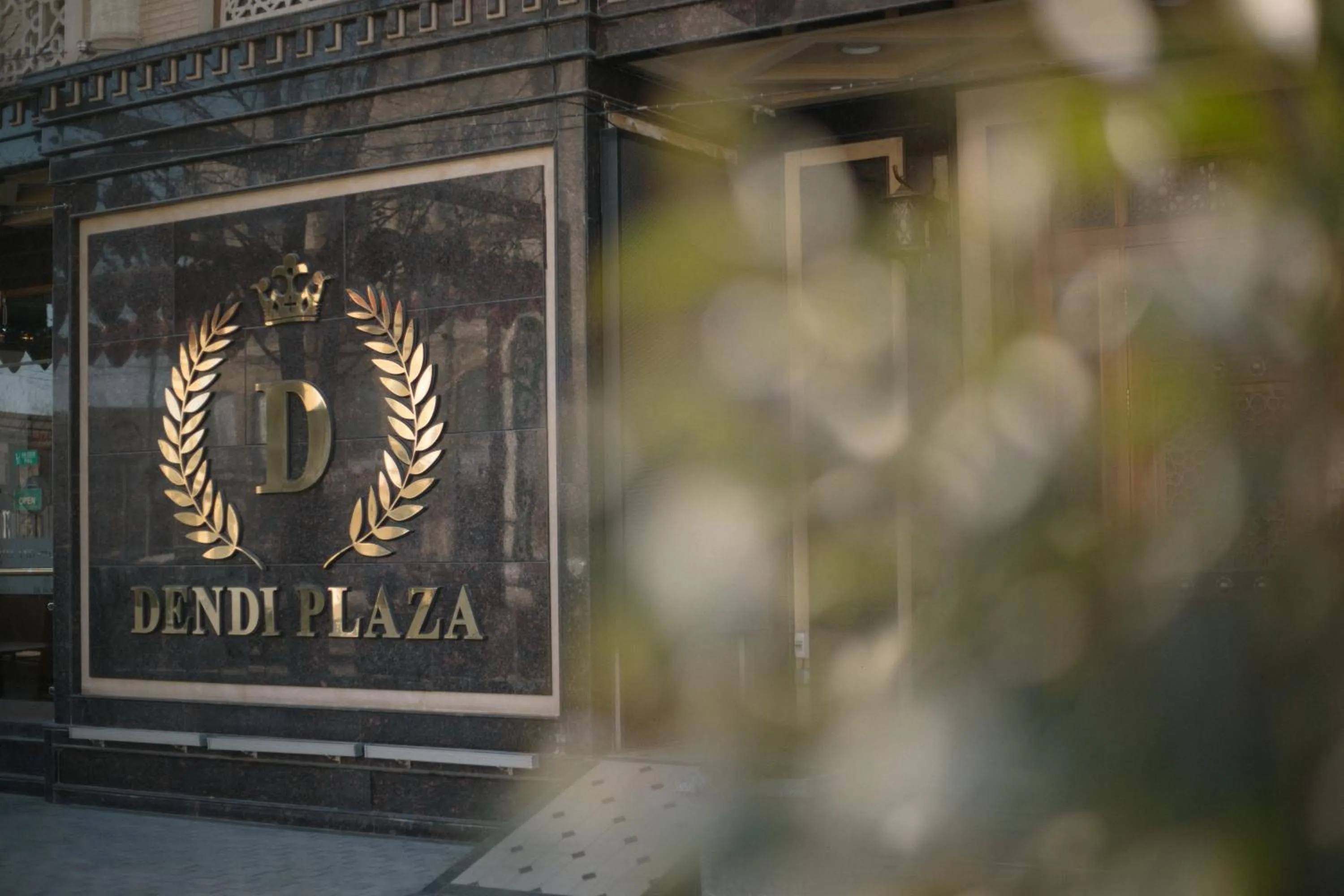 Property logo or sign in Dendi Plaza Hotel