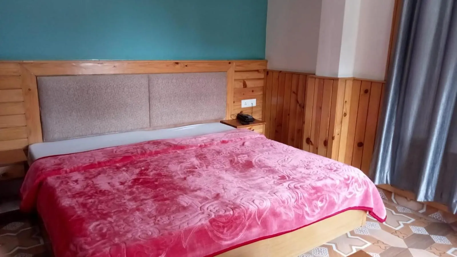 Bed in McLeod Ganj Mountain view