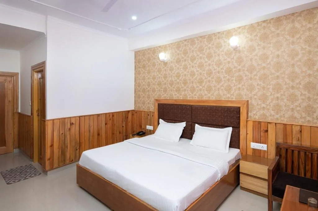 Bed in McLeod Ganj Mountain view