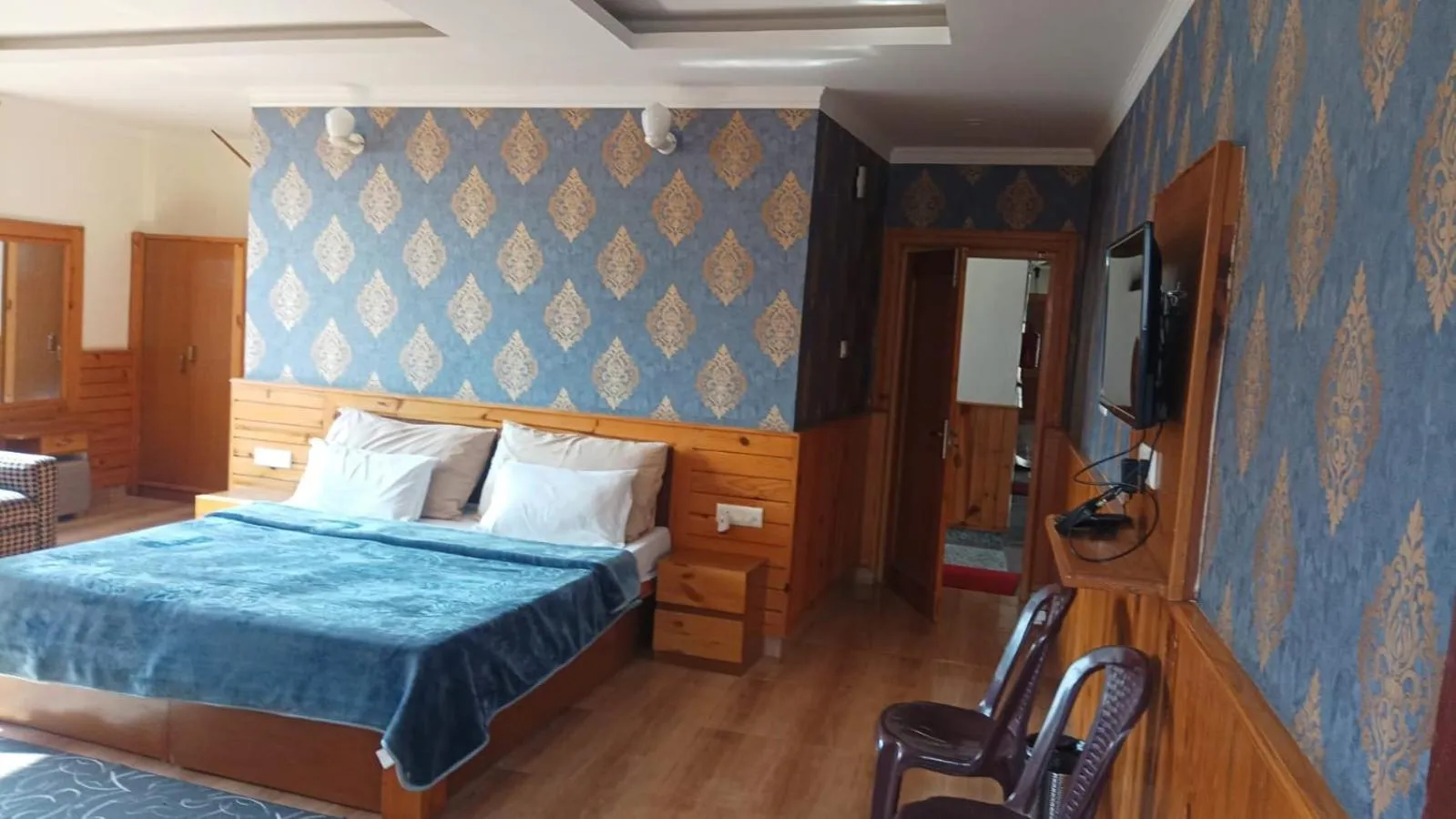 Bed in McLeod Ganj Mountain view