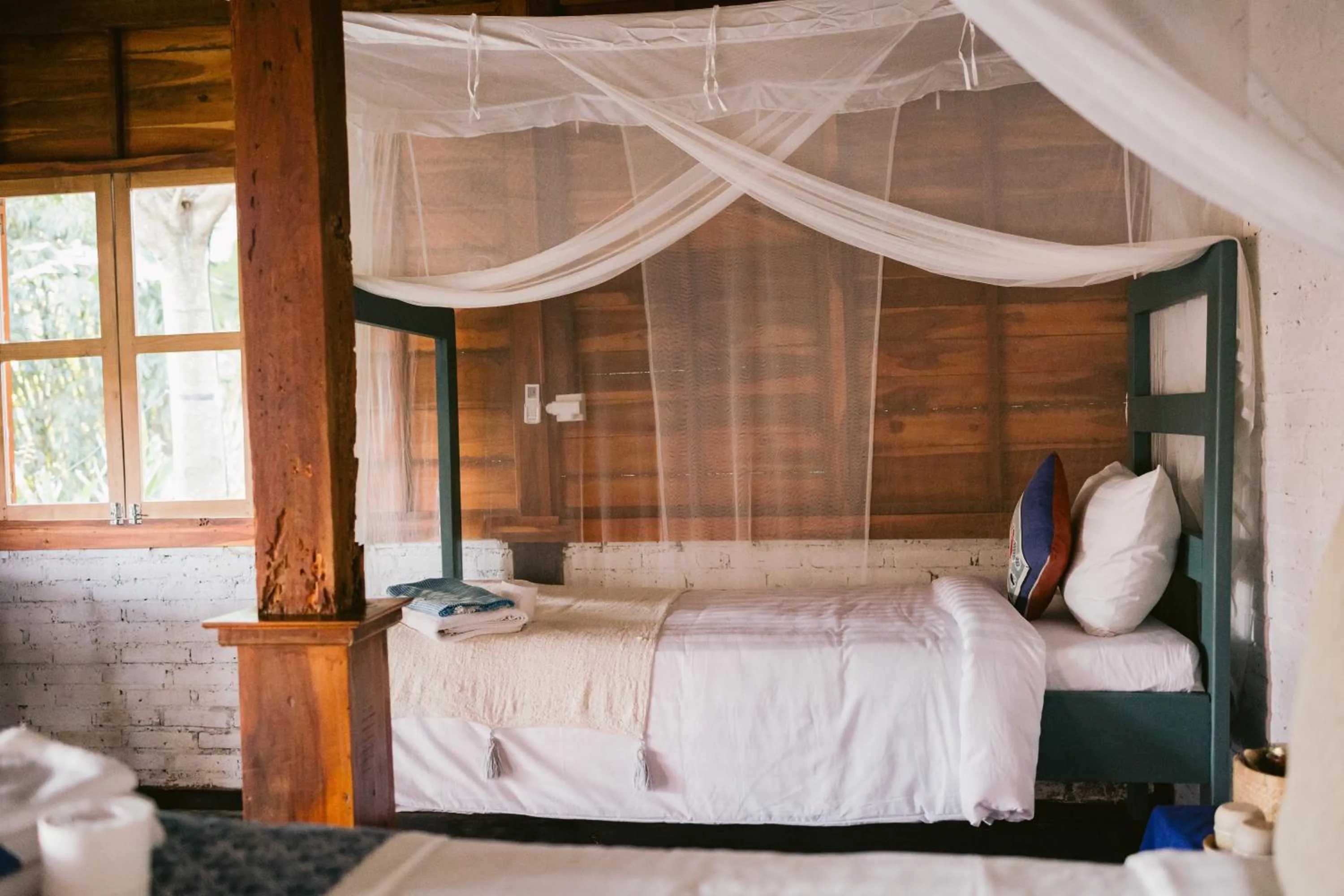 Bed in Ubuntu Bali Eco Yoga Retreat - CANGGU