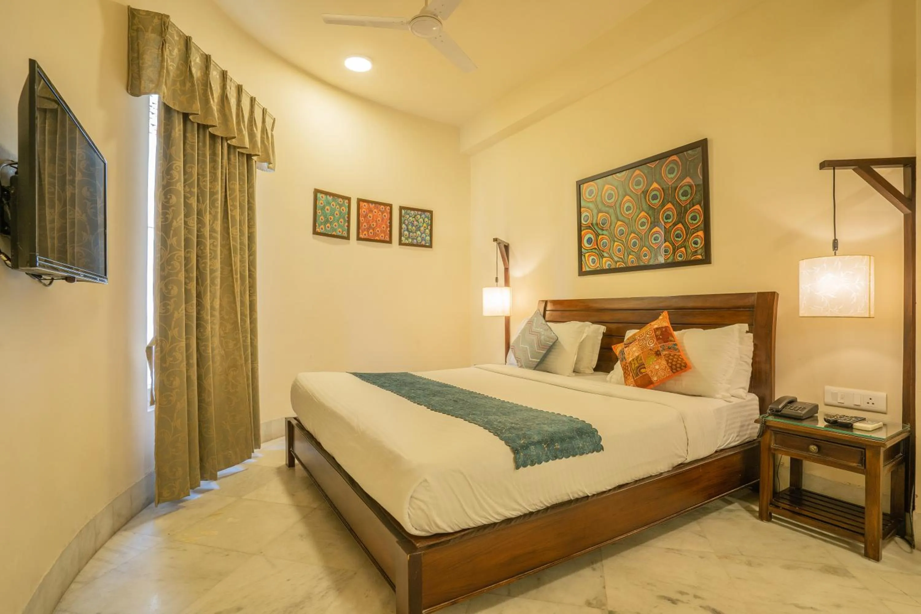 Bed in Tripli Hotels Shambhu Villas