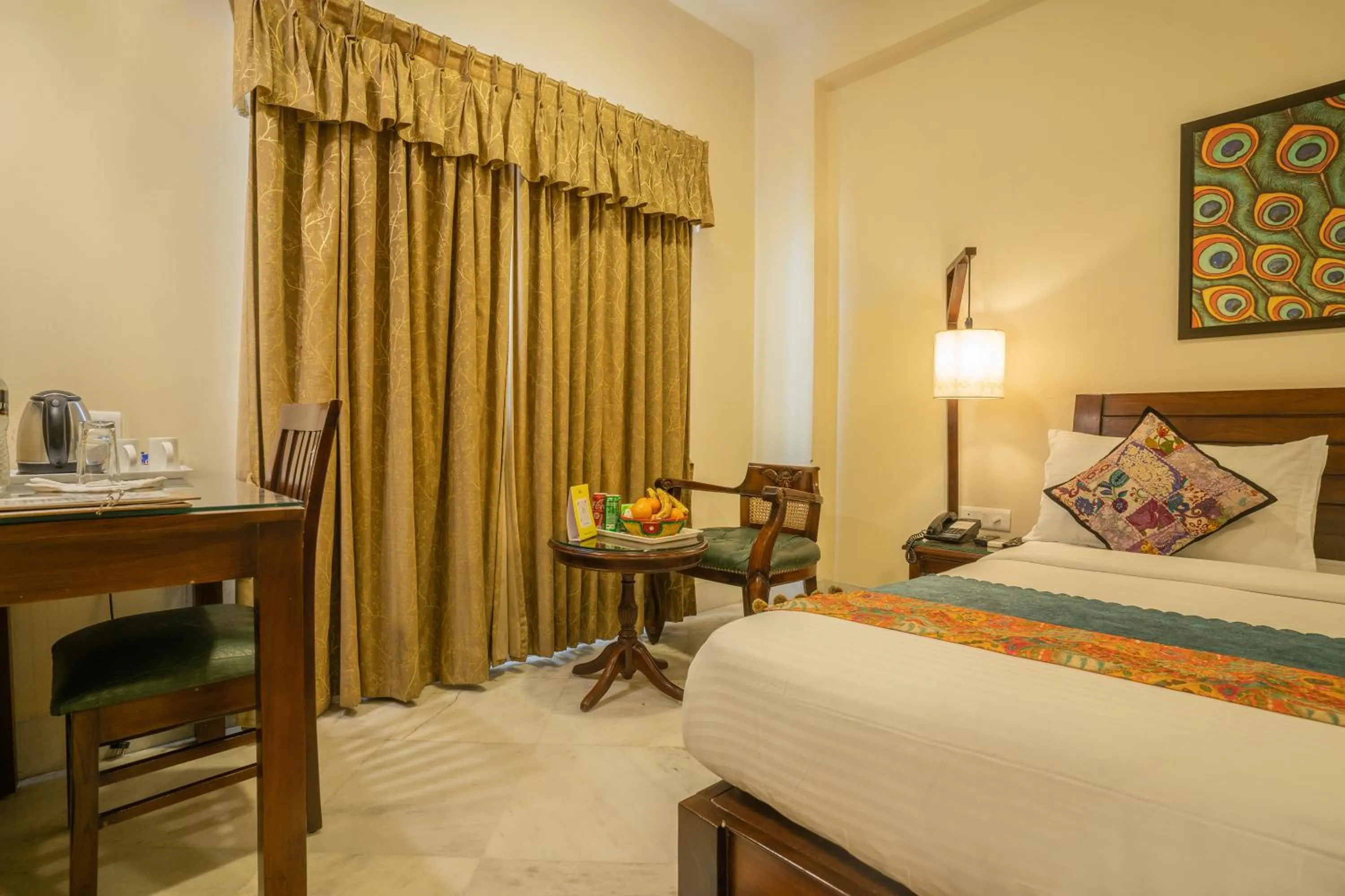 Bed in Tripli Hotels Shambhu Villas