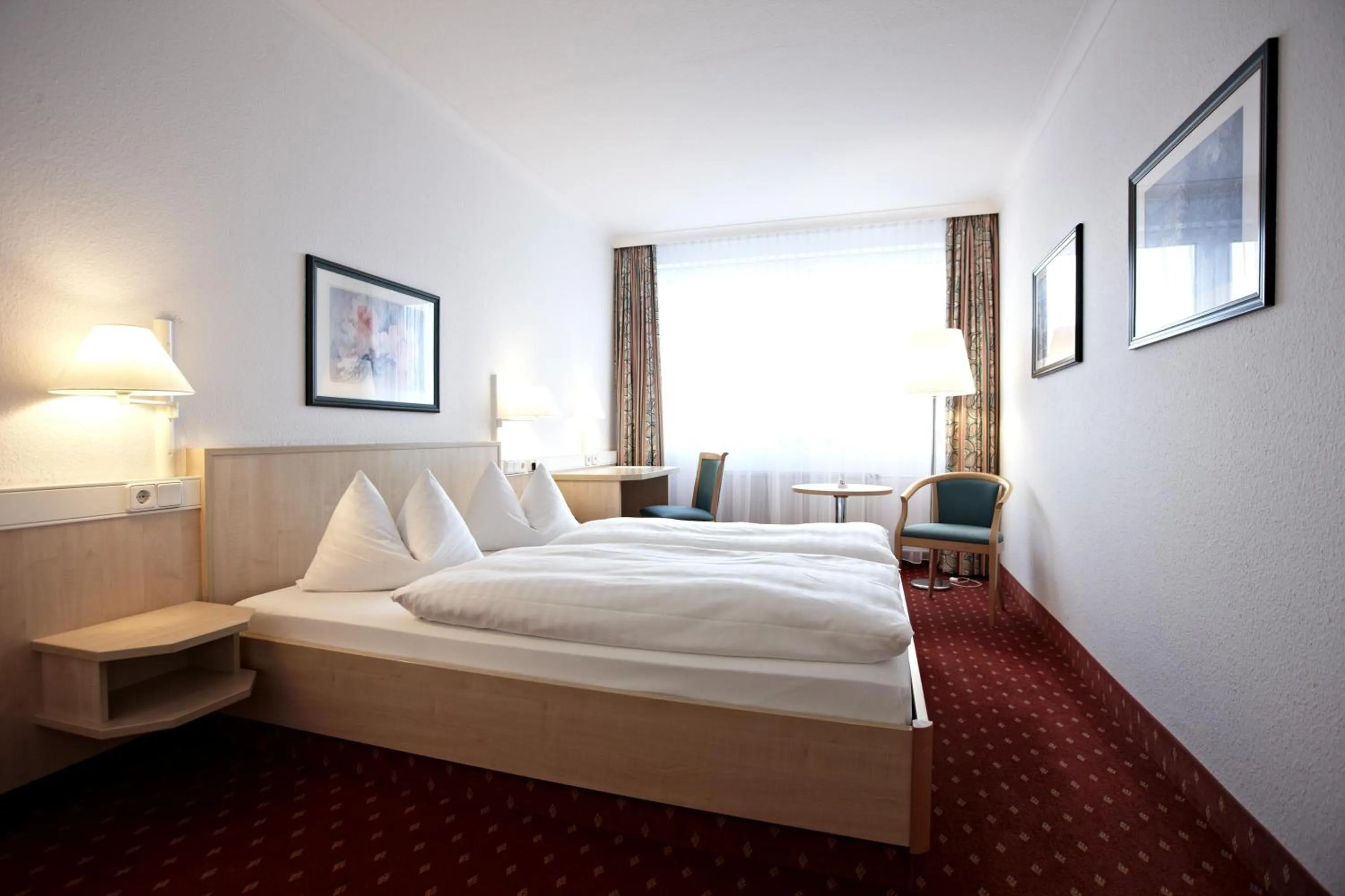 Photo of the whole room, Bed in IntercityHotel Schwerin