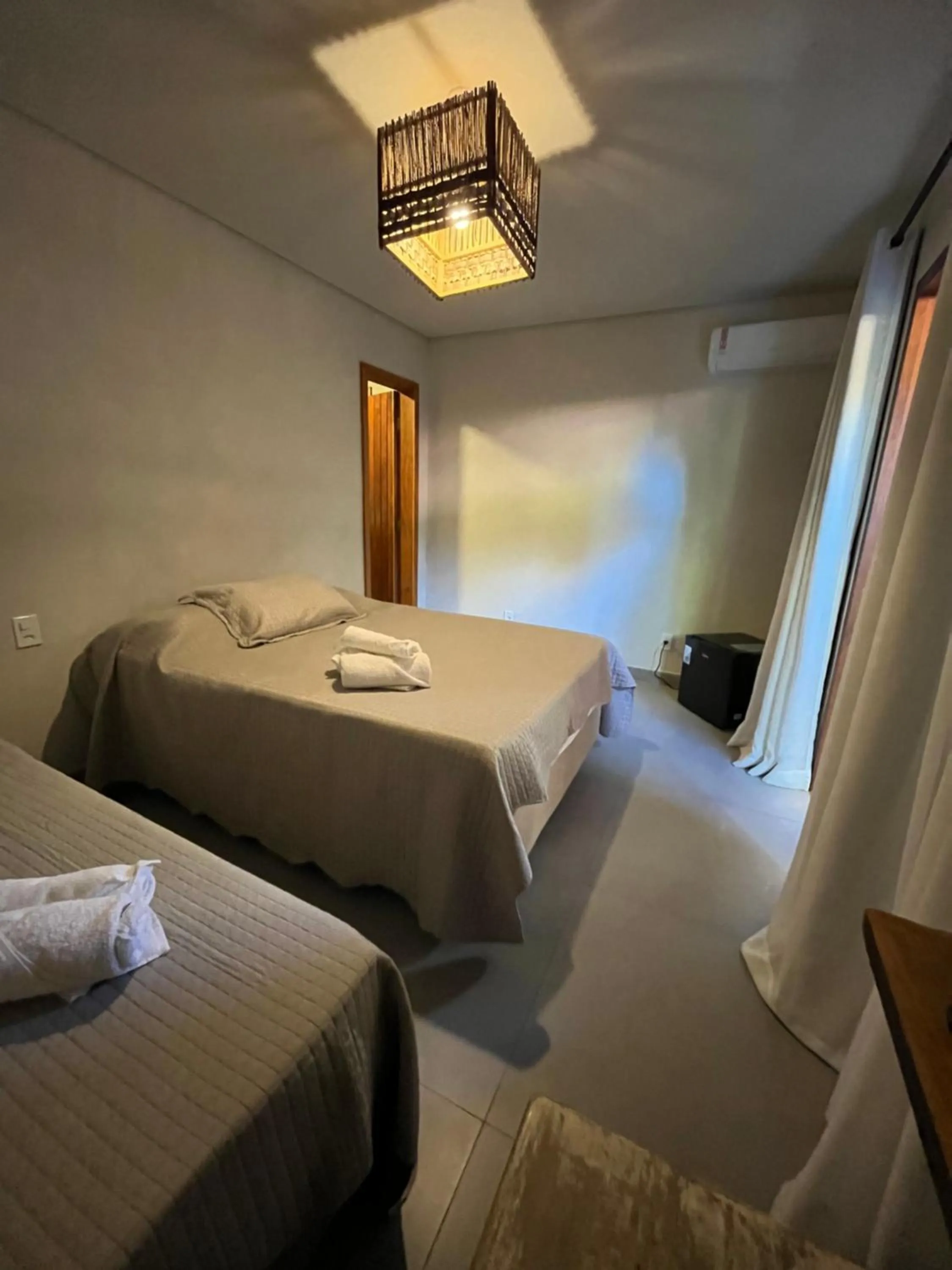 Bed in Pousada Vilarejo