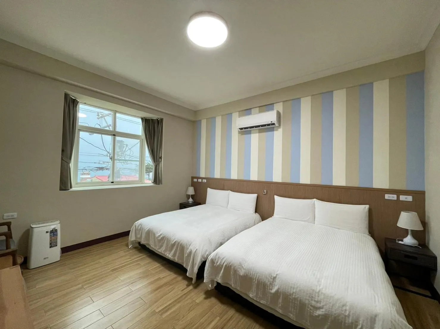 Photo of the whole room, Bed in Loju sunrise inn