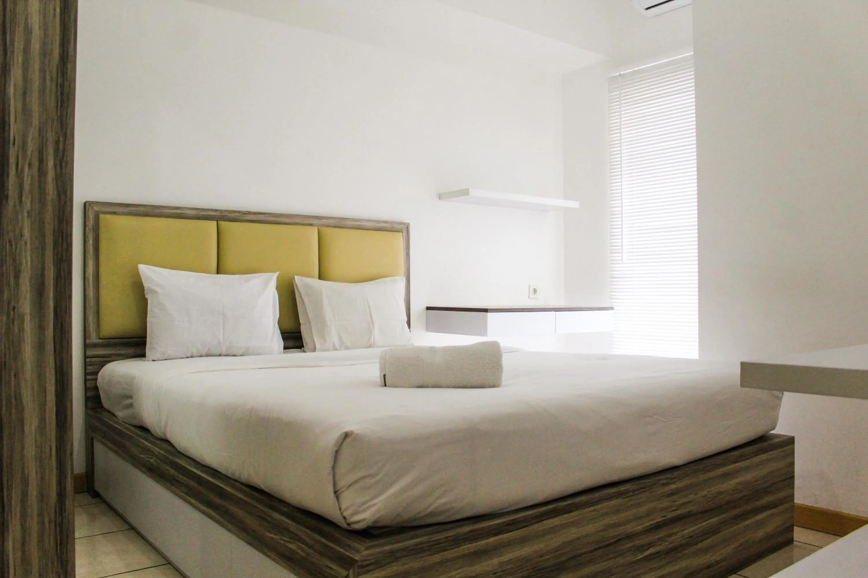 Bed in Relaxing 2BR Apartment at M-Town Residence By Travelio