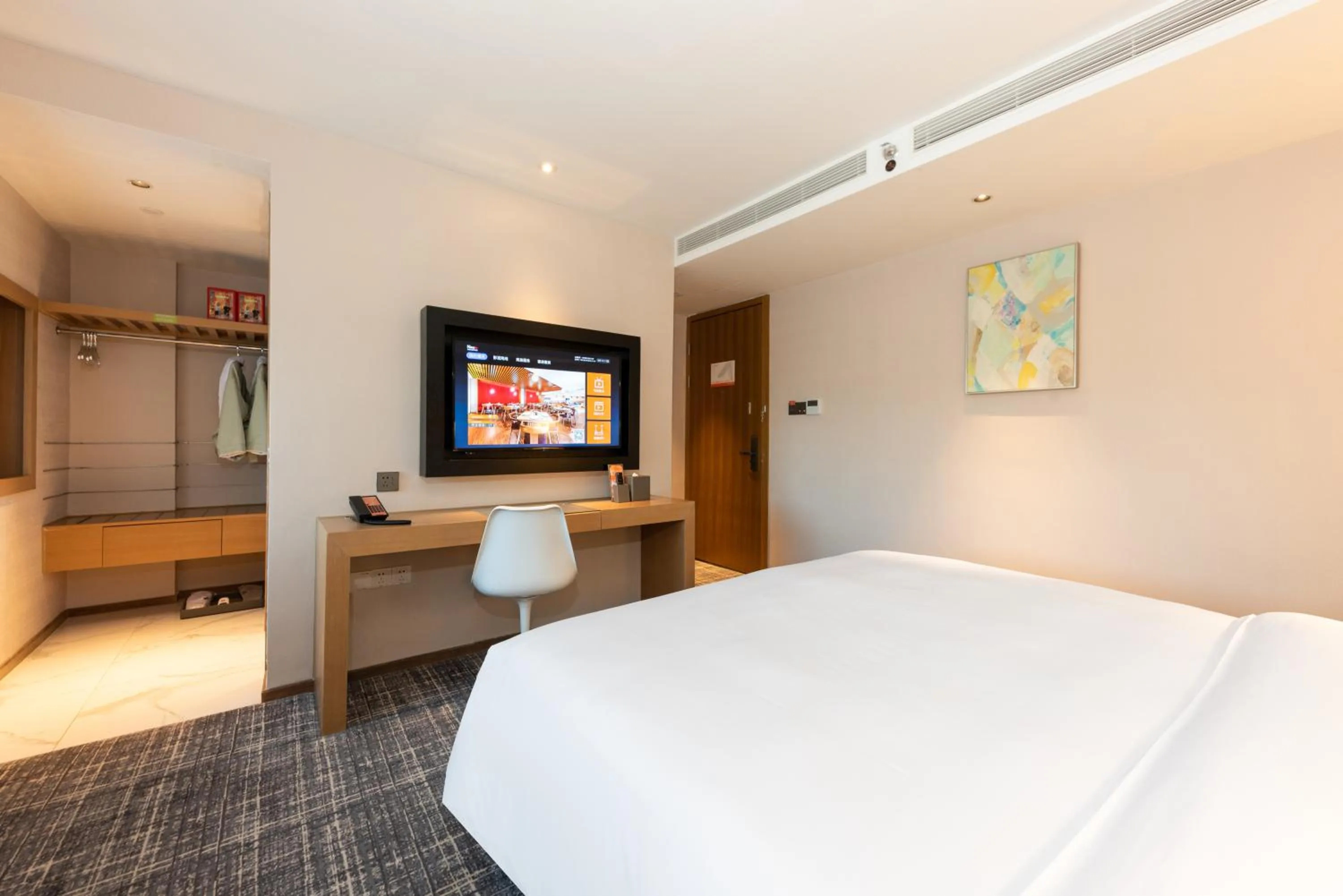 Communal lounge/ TV room, Bed in Xence hotel near Xiamen Airport & SM Mall