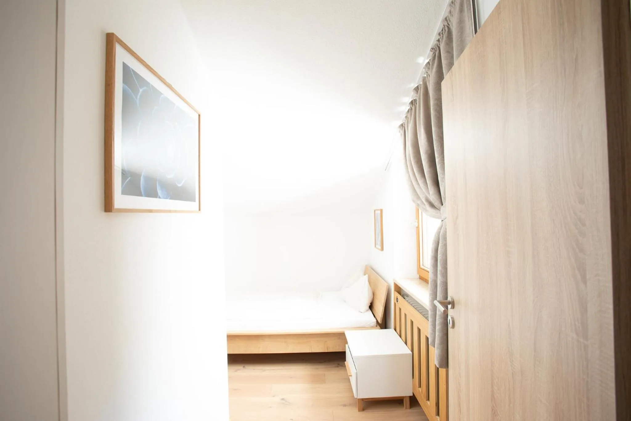 Photo of the whole room, Bed in Yachthotel Chiemsee GmbH