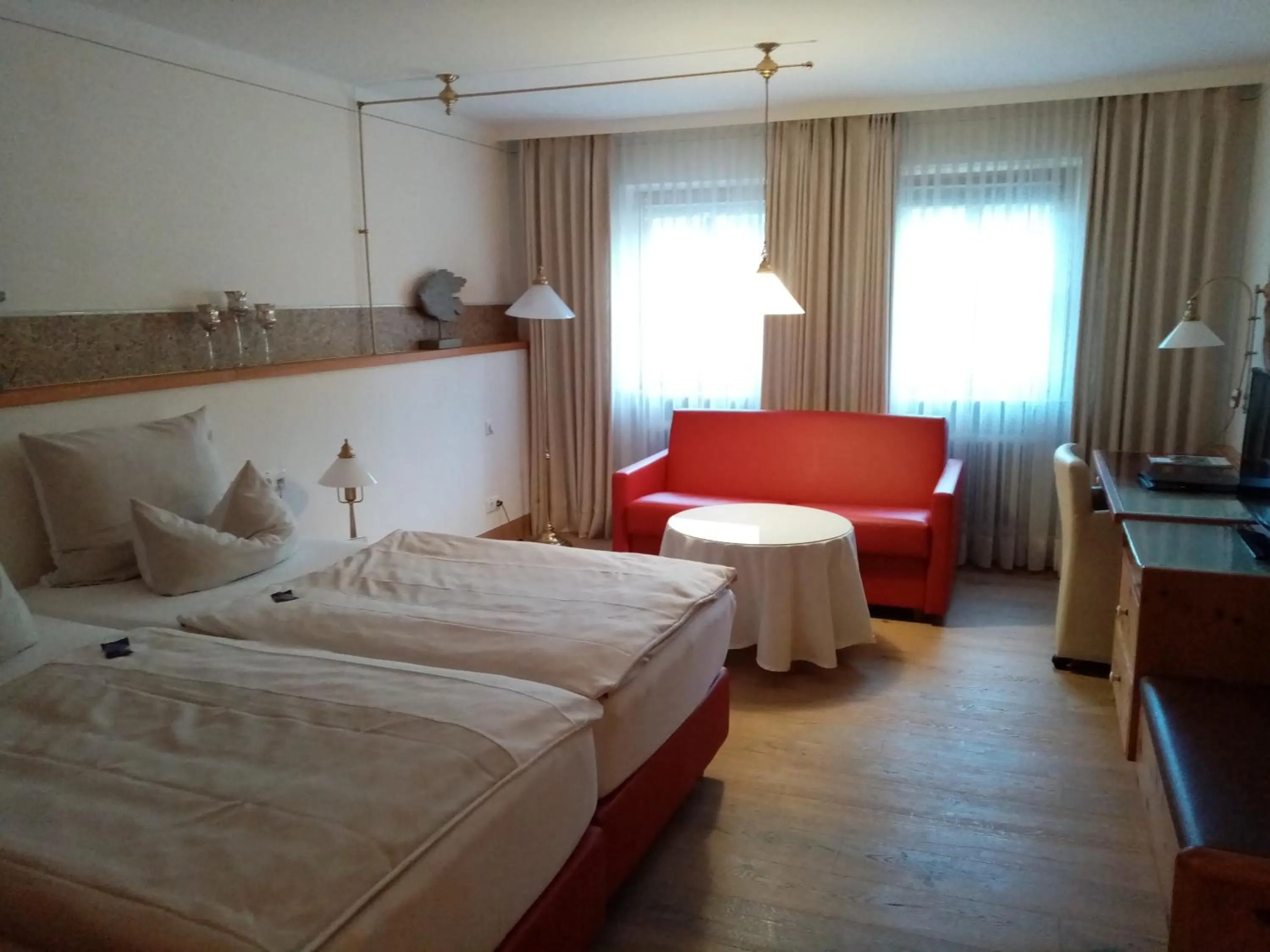 Photo of the whole room, Bed in Yachthotel Chiemsee GmbH