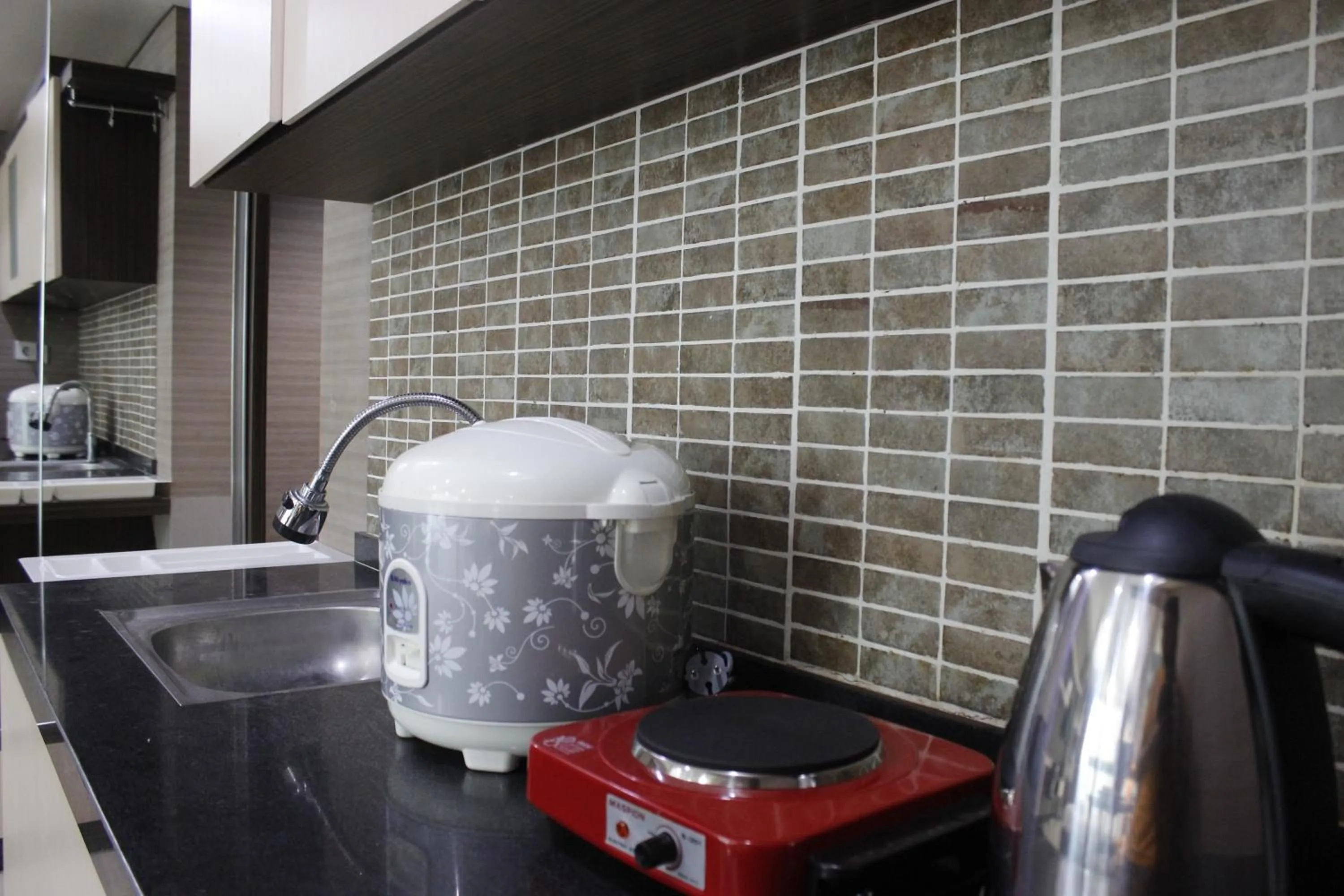 Prime and Comfy Studio at Tamansari La Grande Apartment By Travelio