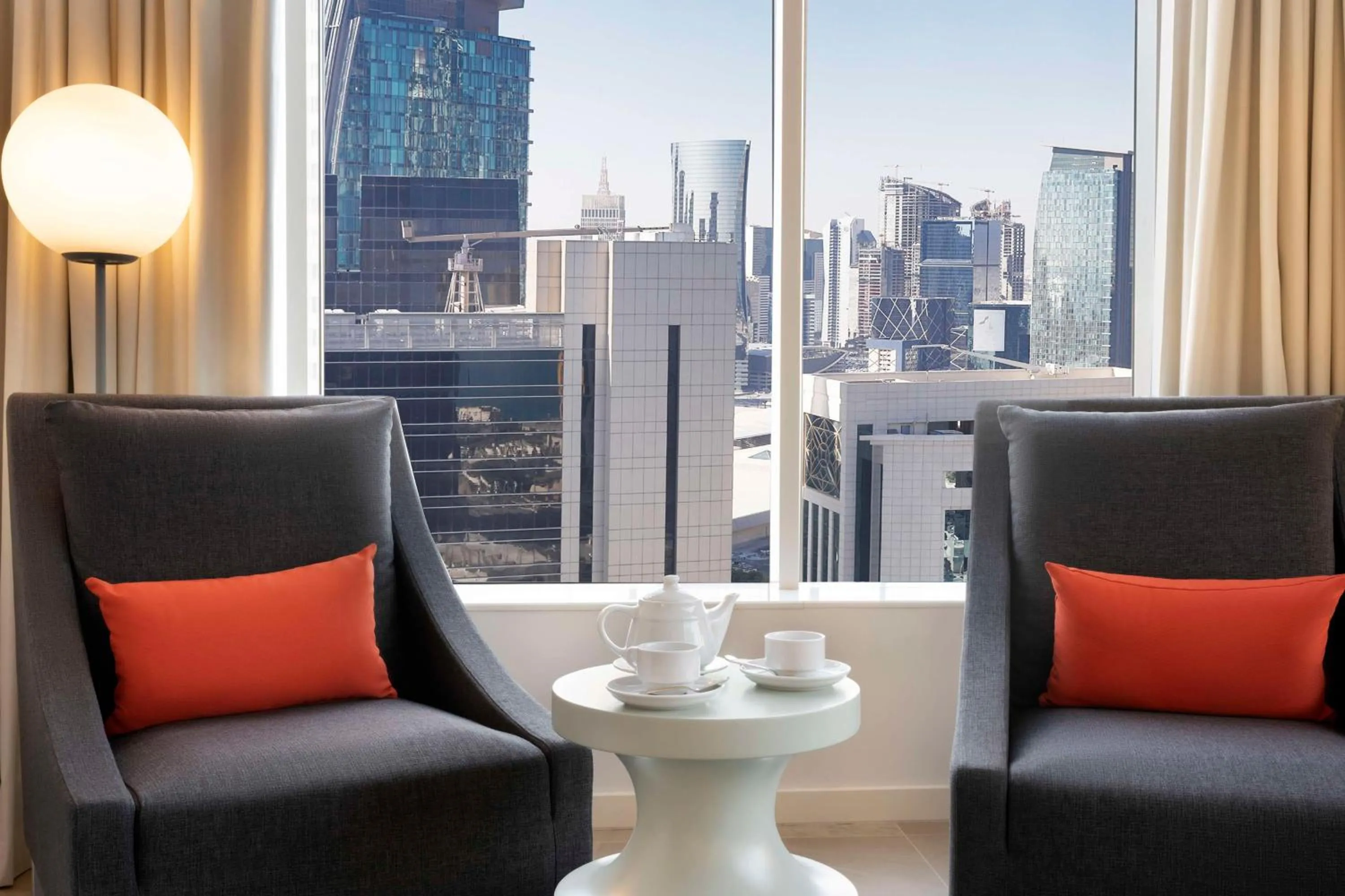 Living room in Aleph Doha Residences, Curio Collection By Hilton