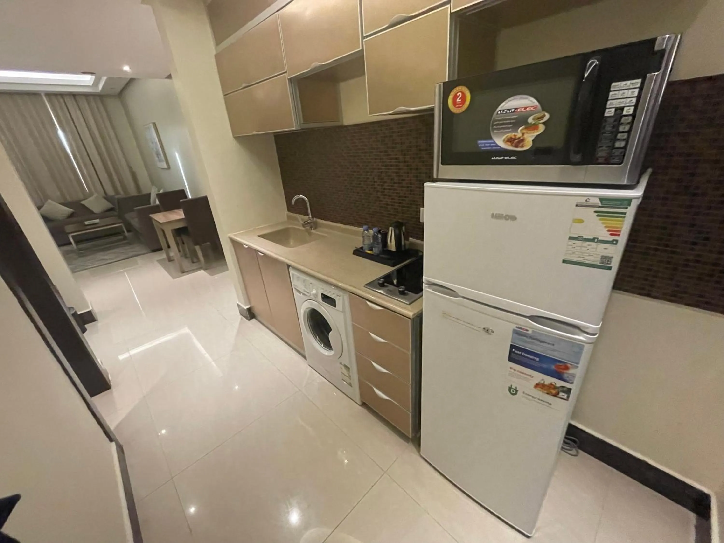 Kitchen or kitchenette in Makarem Residence - Hotel Apartments