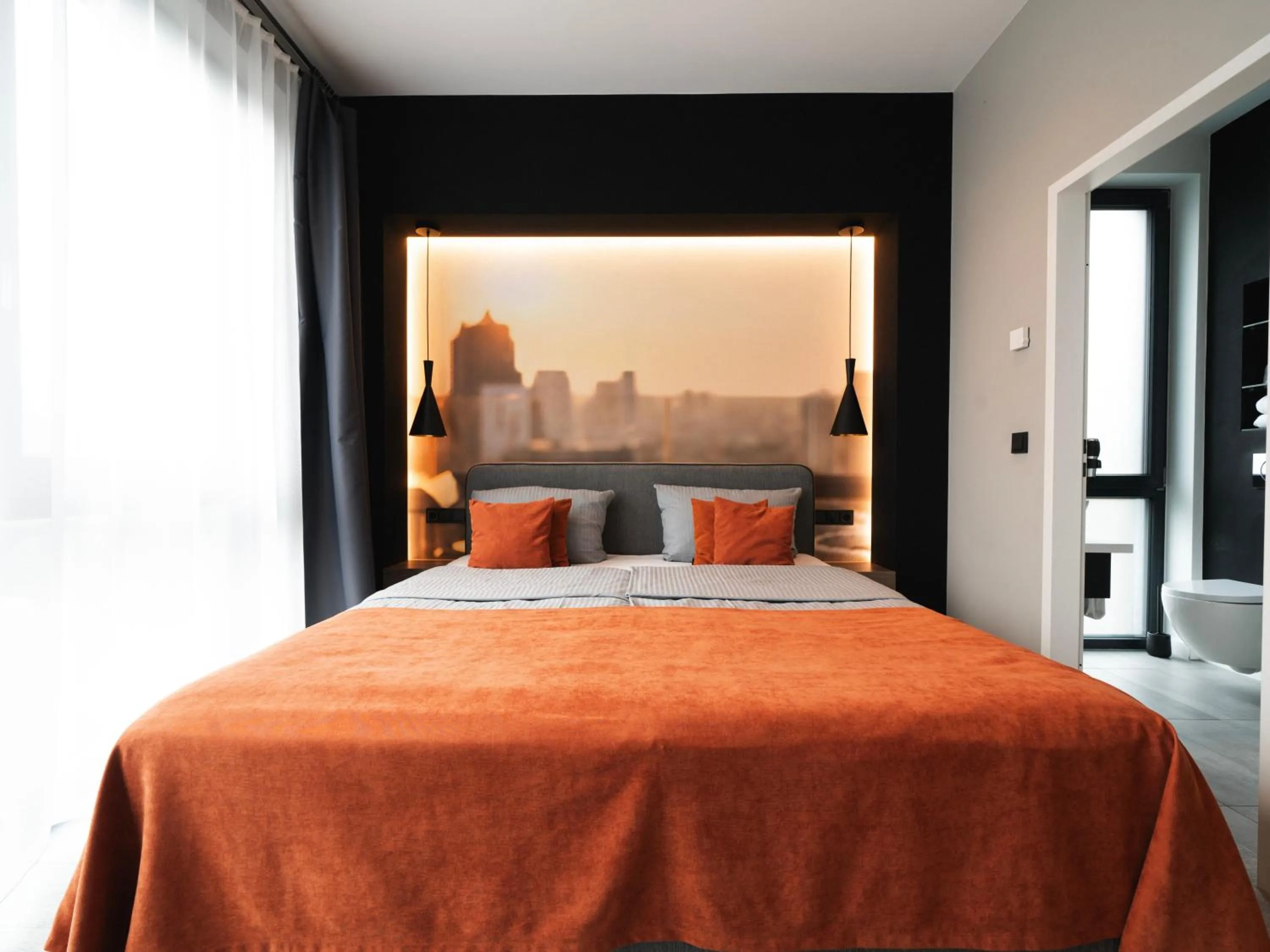 Toilet, Bed in JustStay Grevenbroich Hotel & Apartments