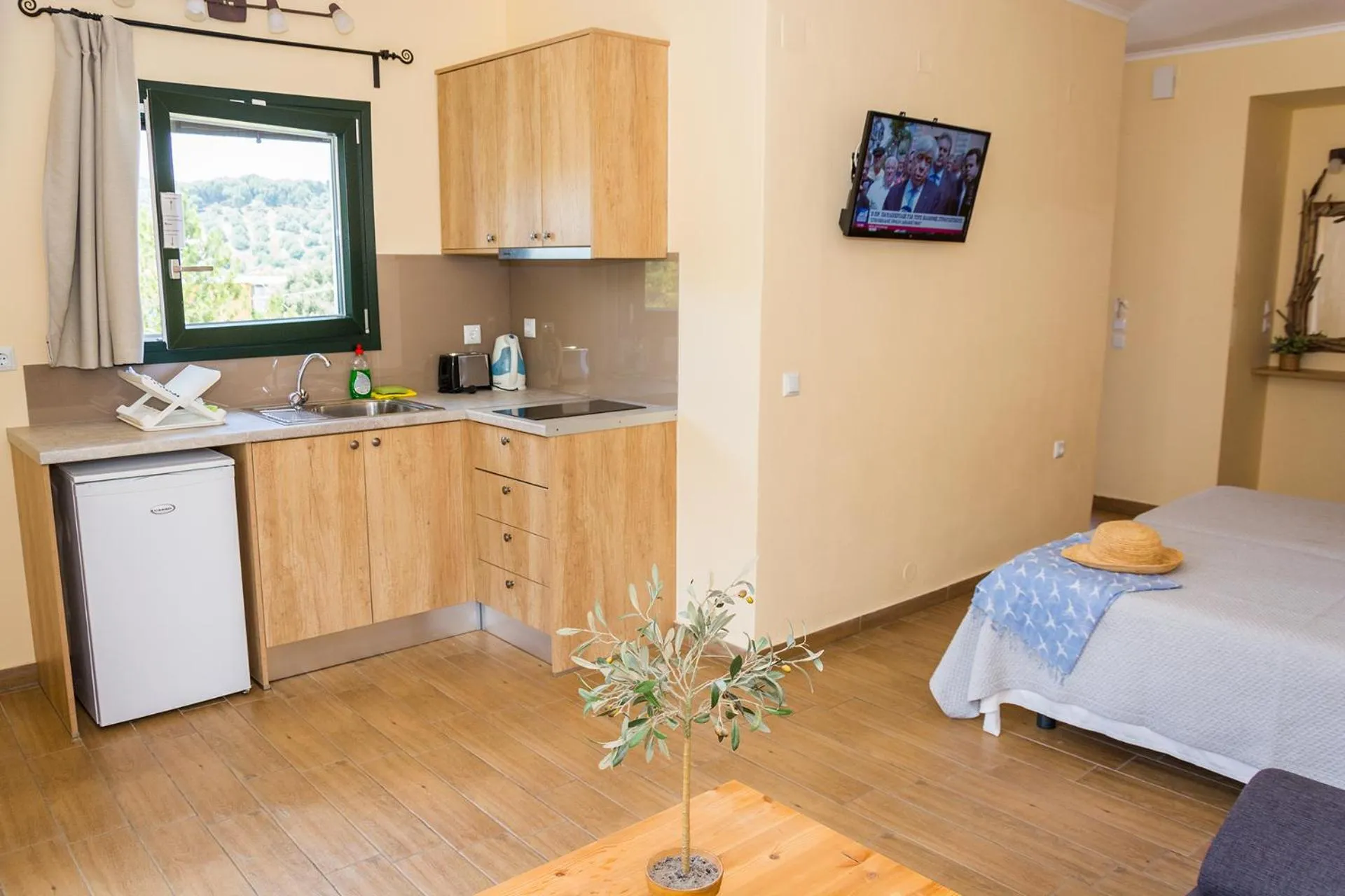 Kitchen or kitchenette, Bed in Donatos Apartments & Studios