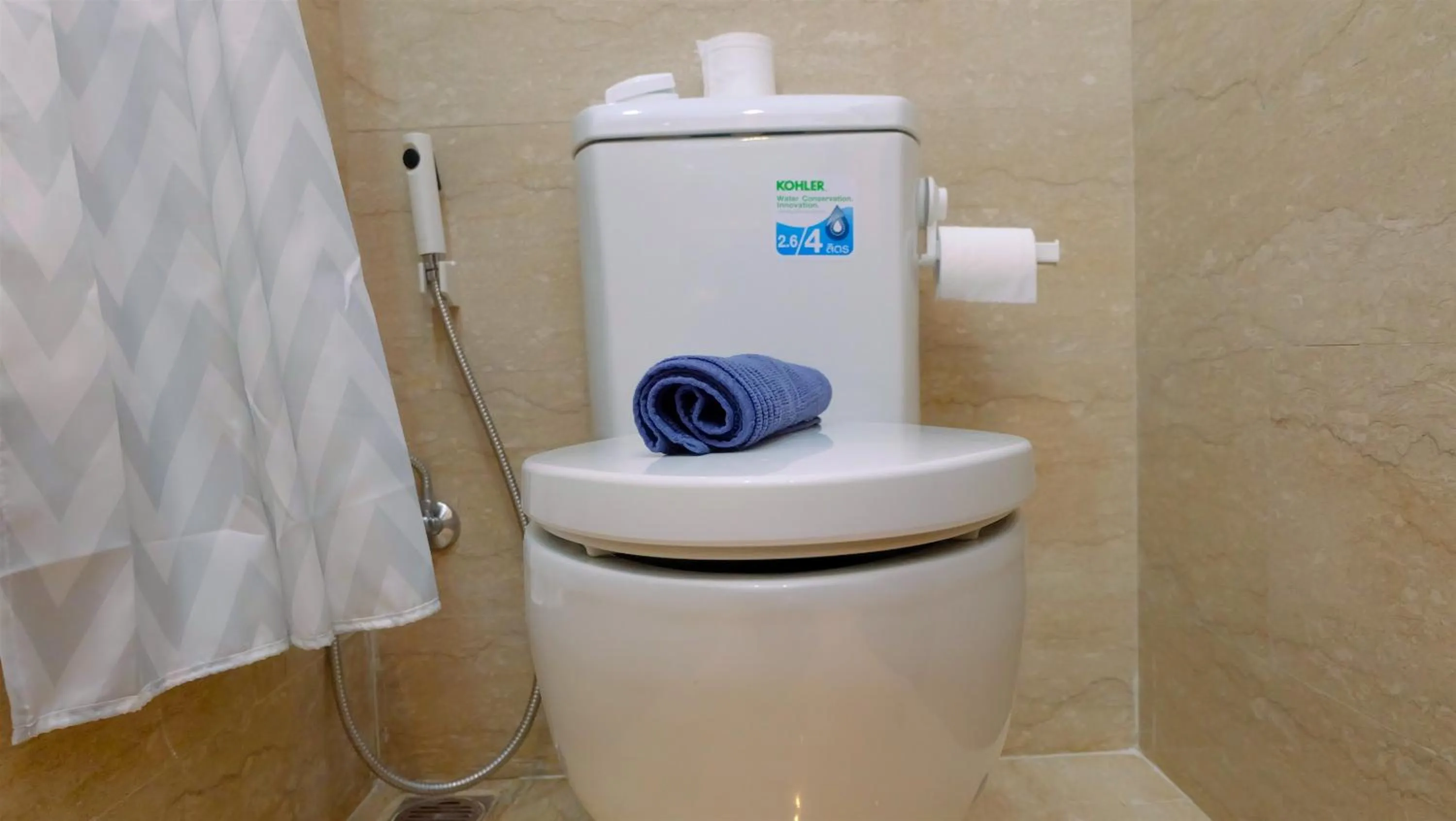 Bathroom in Classy 2BR Apartment at Menteng Park with City View By Travelio