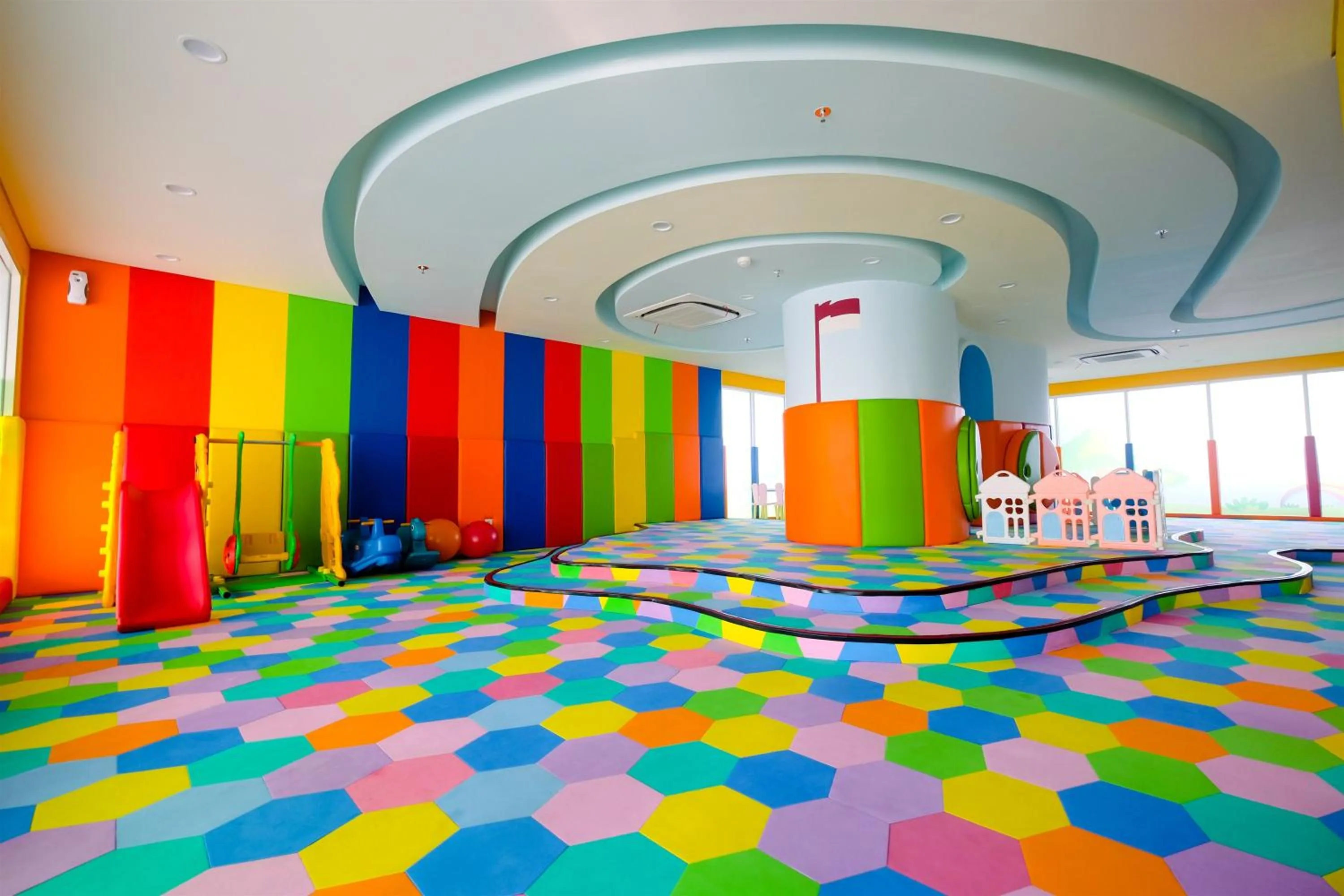 Children play ground in Classy 2BR Apartment at Menteng Park with City View By Travelio