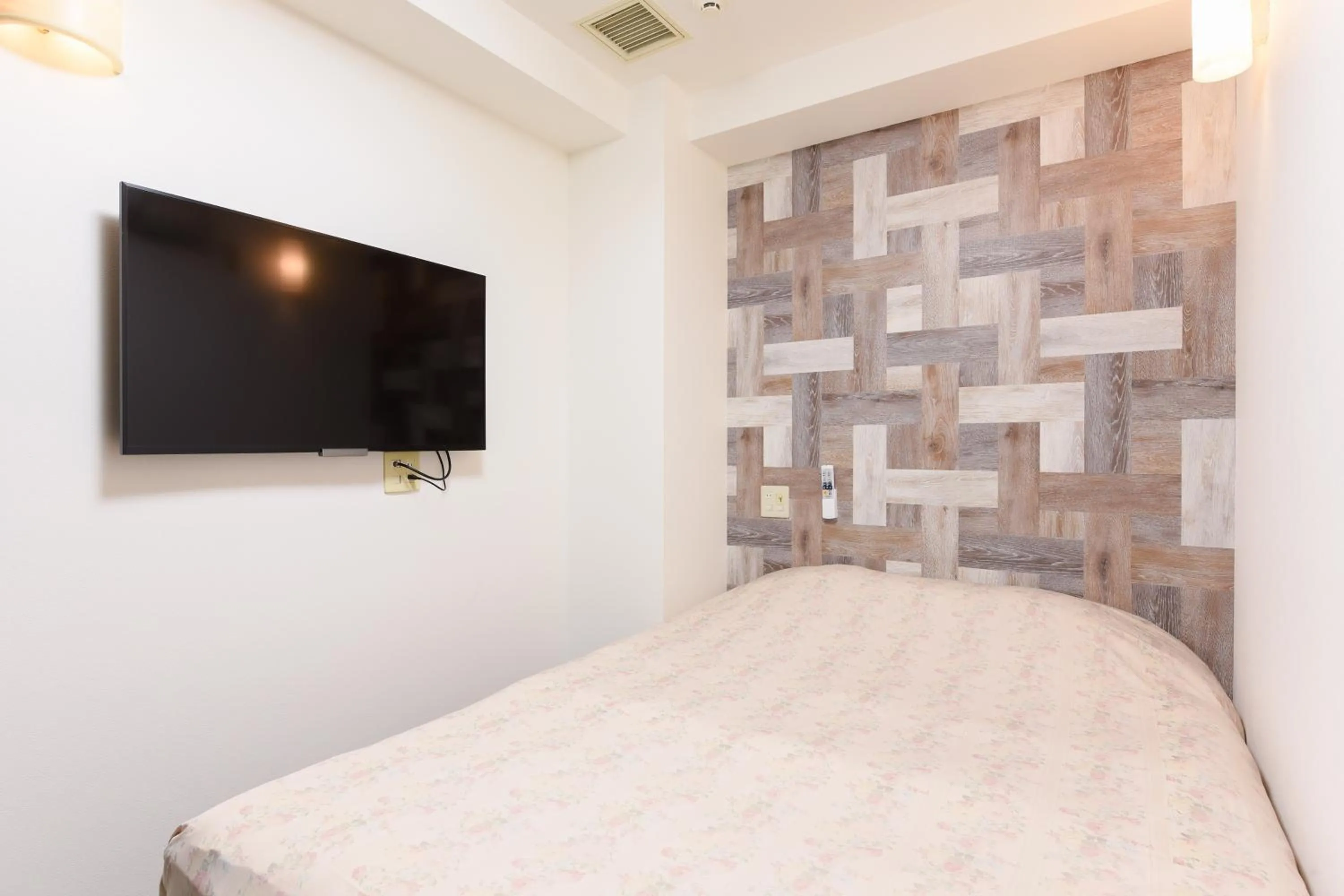 Bed in Otsuka Town Hotel