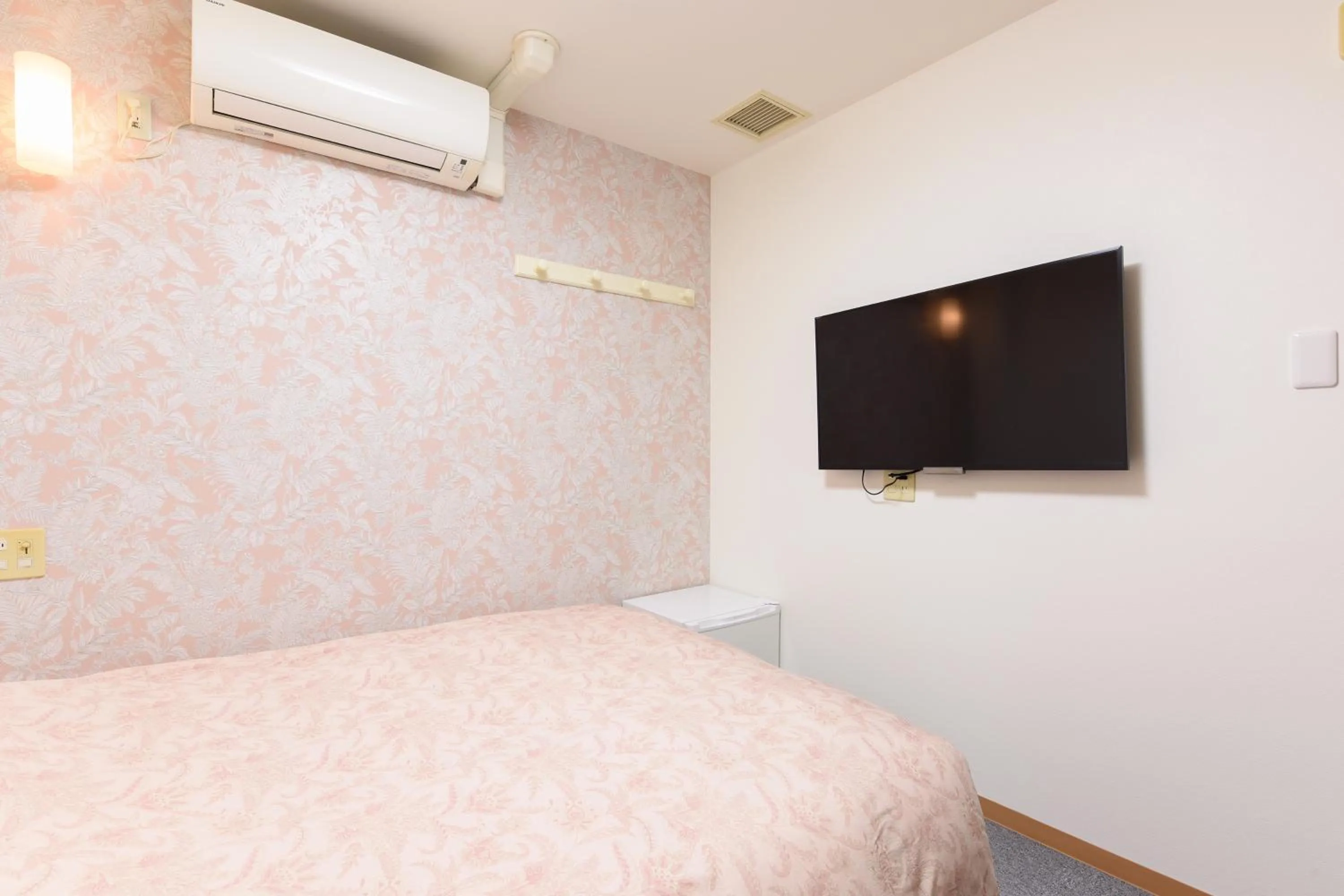 Bed in Otsuka Town Hotel