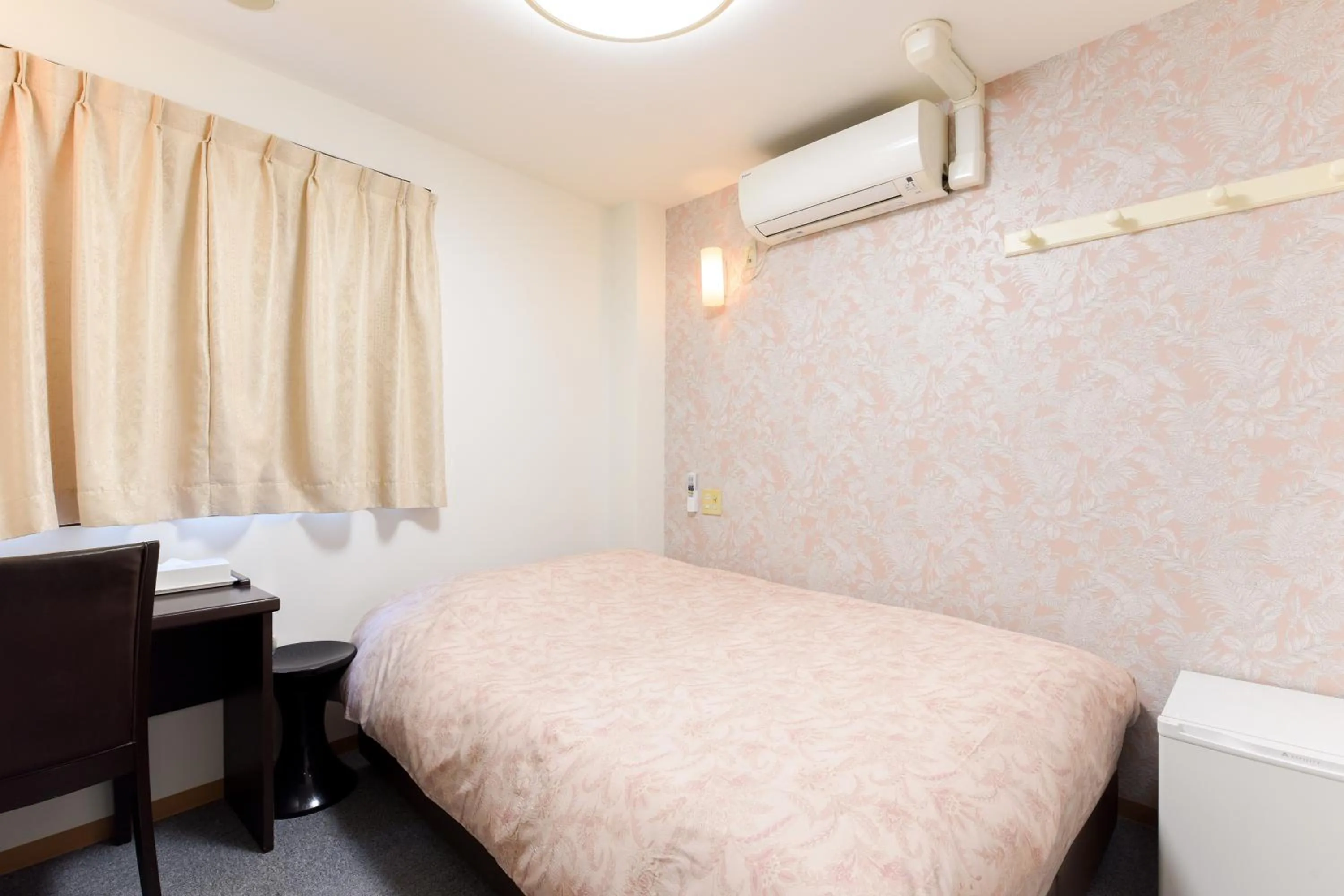 Bed in Otsuka Town Hotel