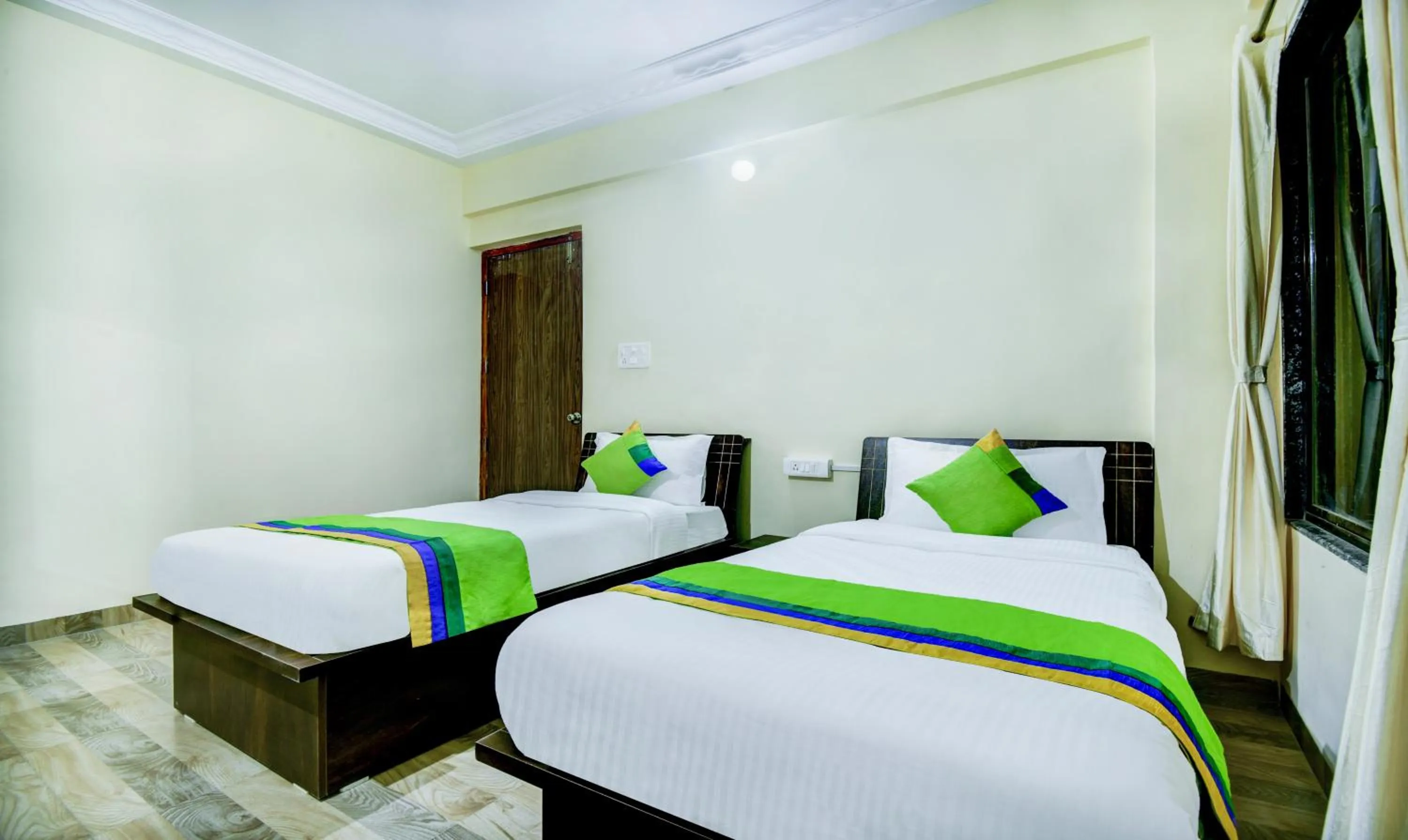 Bed in Treebo Sayaji Residency