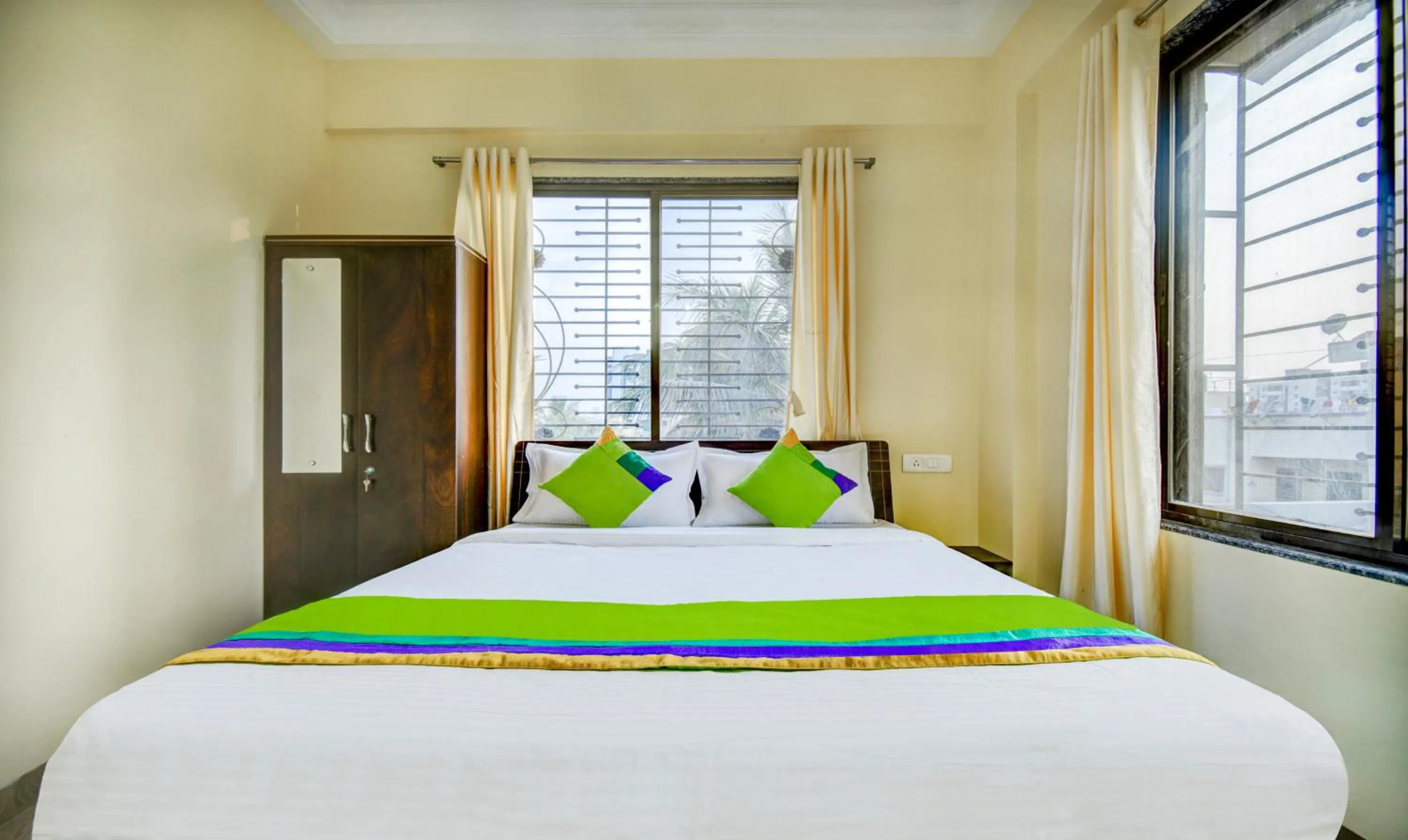 Bed in Treebo Sayaji Residency