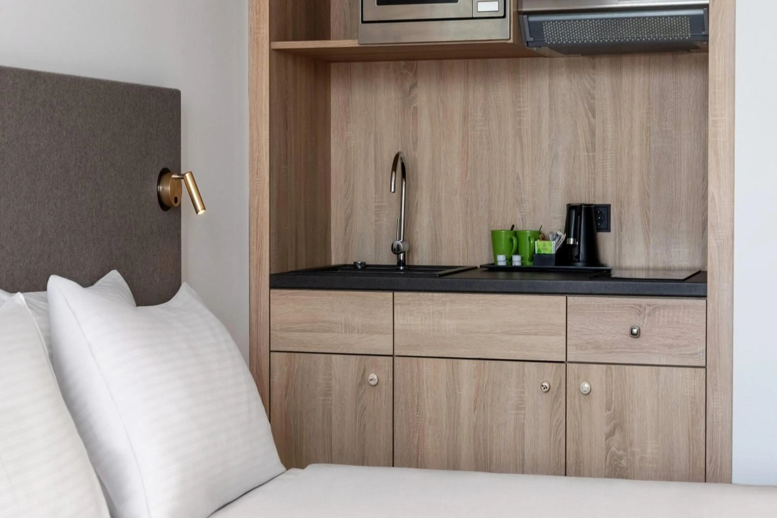 Photo of the whole room, Bed in Wyndham Garden Munich Messe