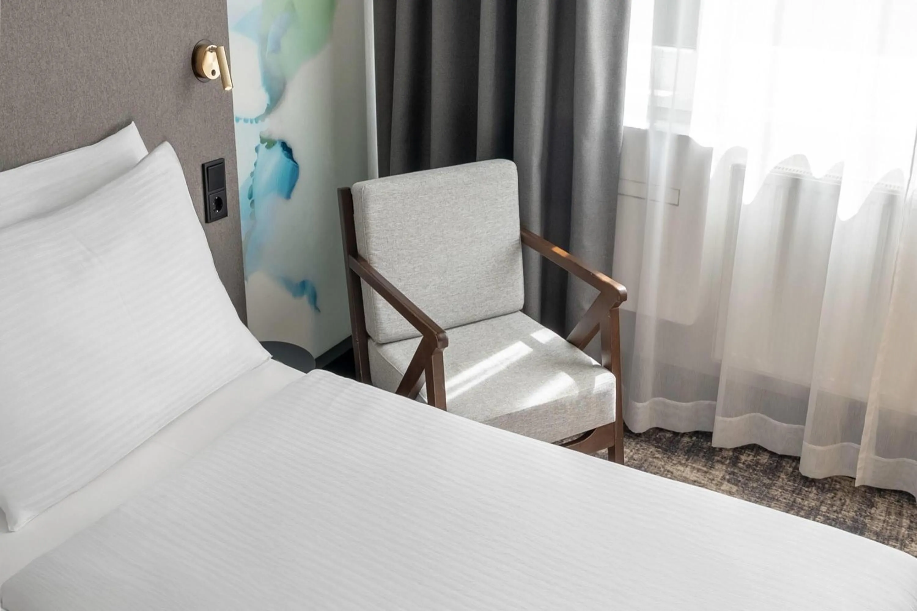 Photo of the whole room, Bed in Wyndham Garden Munich Messe