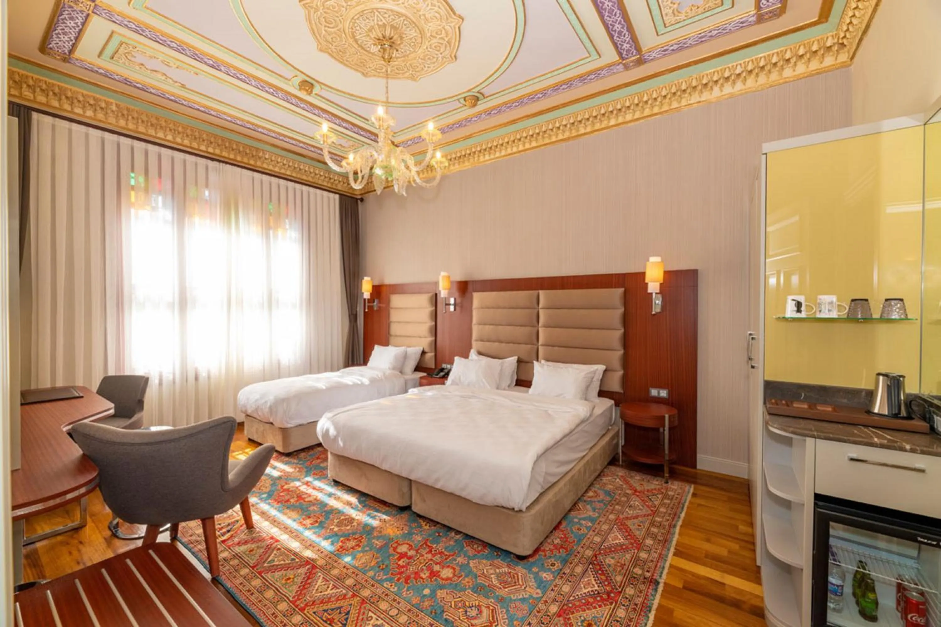 Bed in Blue Gilroy Hotel