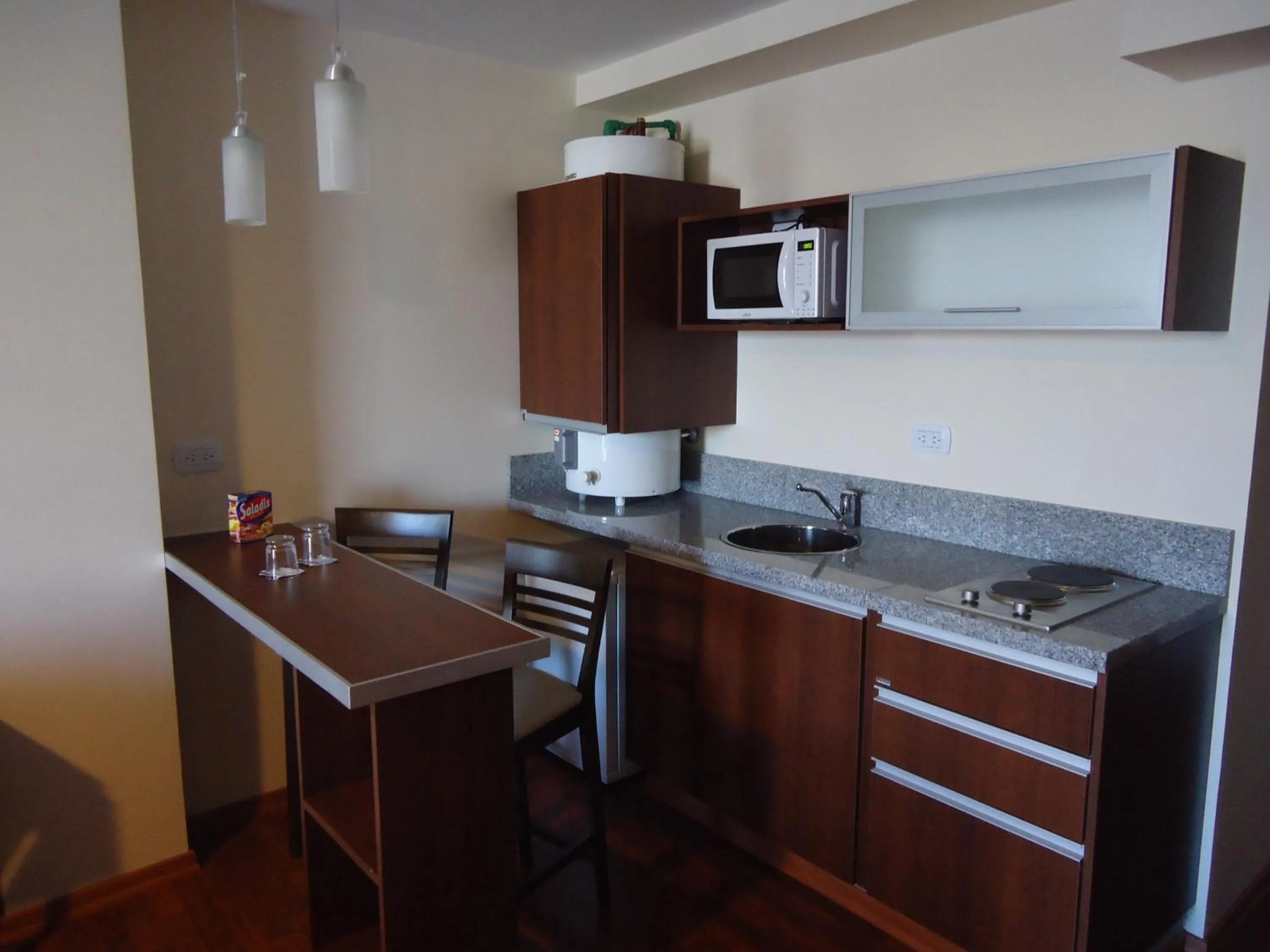 Kitchen or kitchenette in Puerto Amarras Hotel & Suites