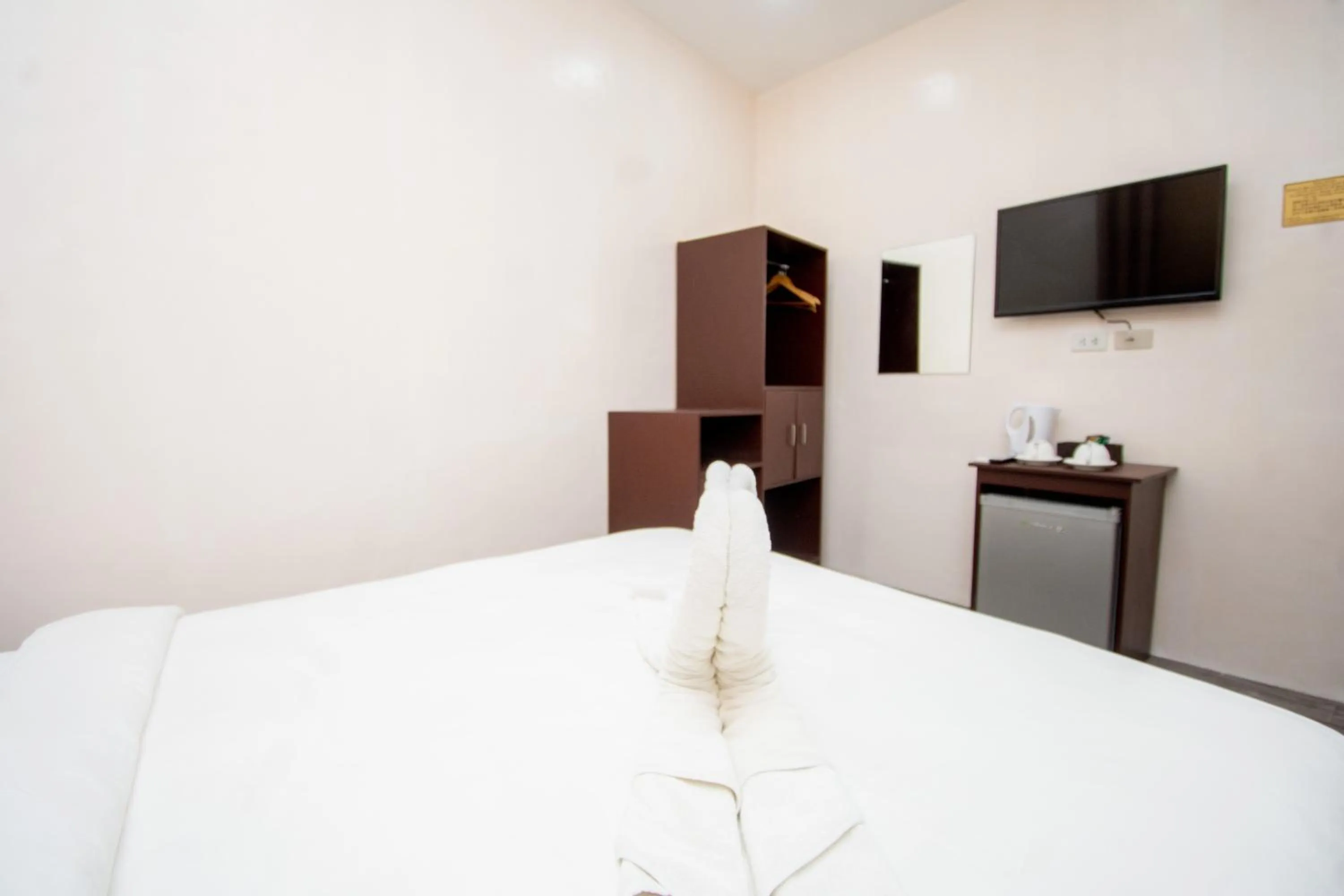 Bed in Emerald Island Hotel