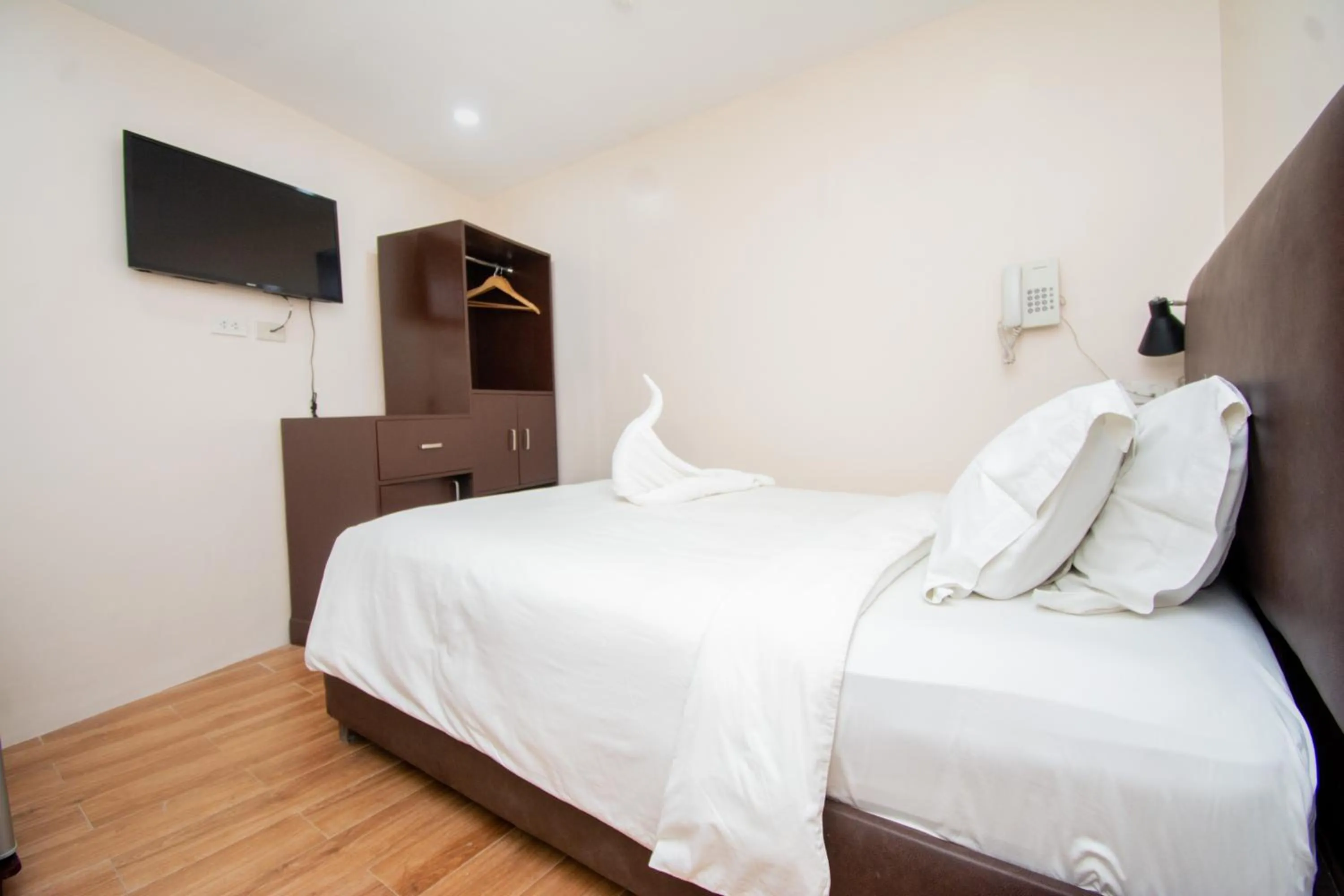 Bed in Emerald Island Hotel