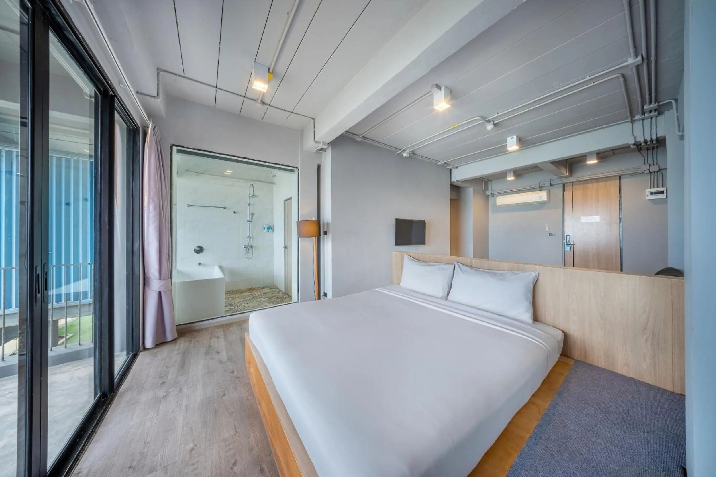 Bed in SHIN Arch39 Phuket Beach Front - SHA Plus