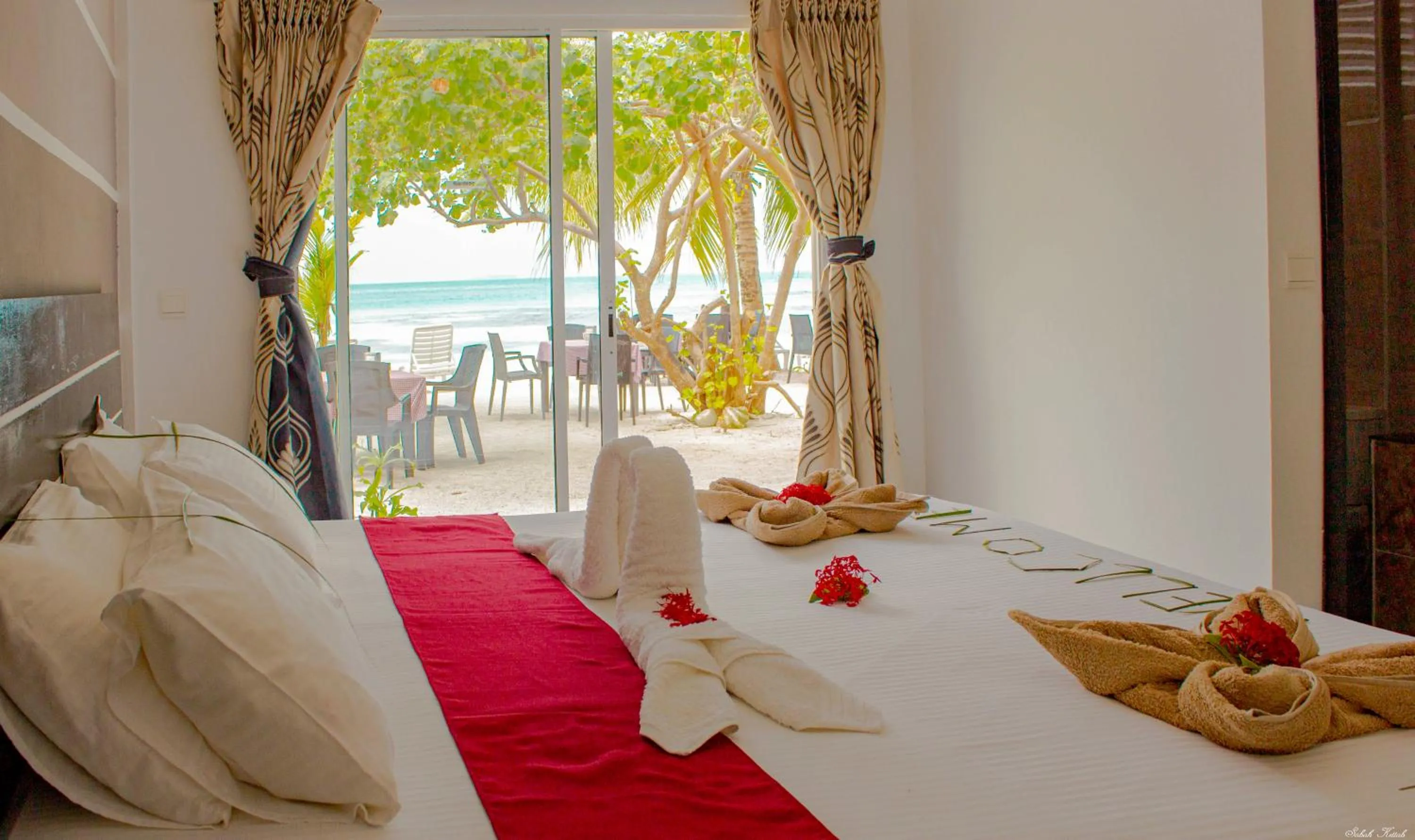 Bed in Crown Beach Villas -Private Beach
