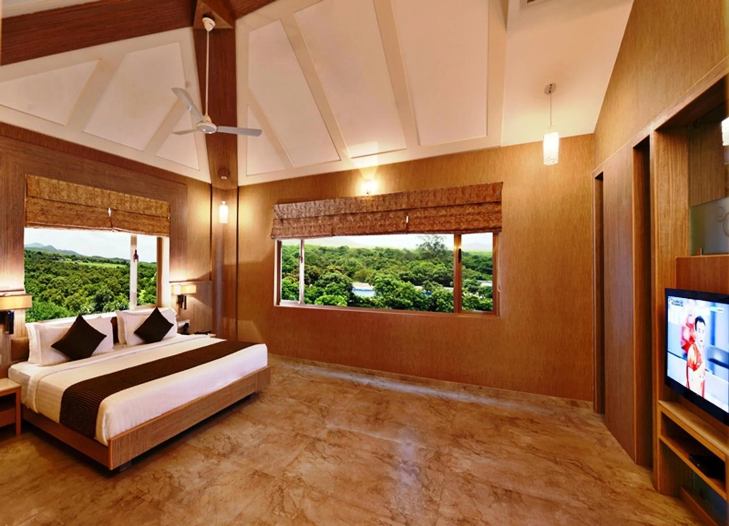 Photo of the whole room, Bed in Sarovar Portico Sasangir