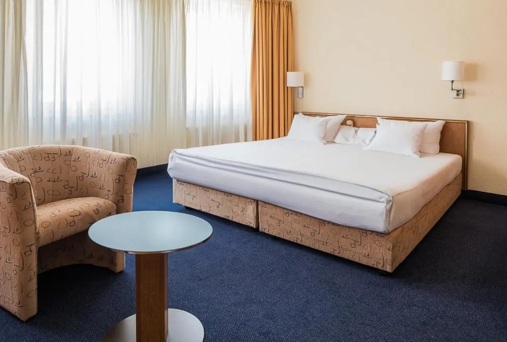 Photo of the whole room, Bed in Hotel Residenz Limburgerhof