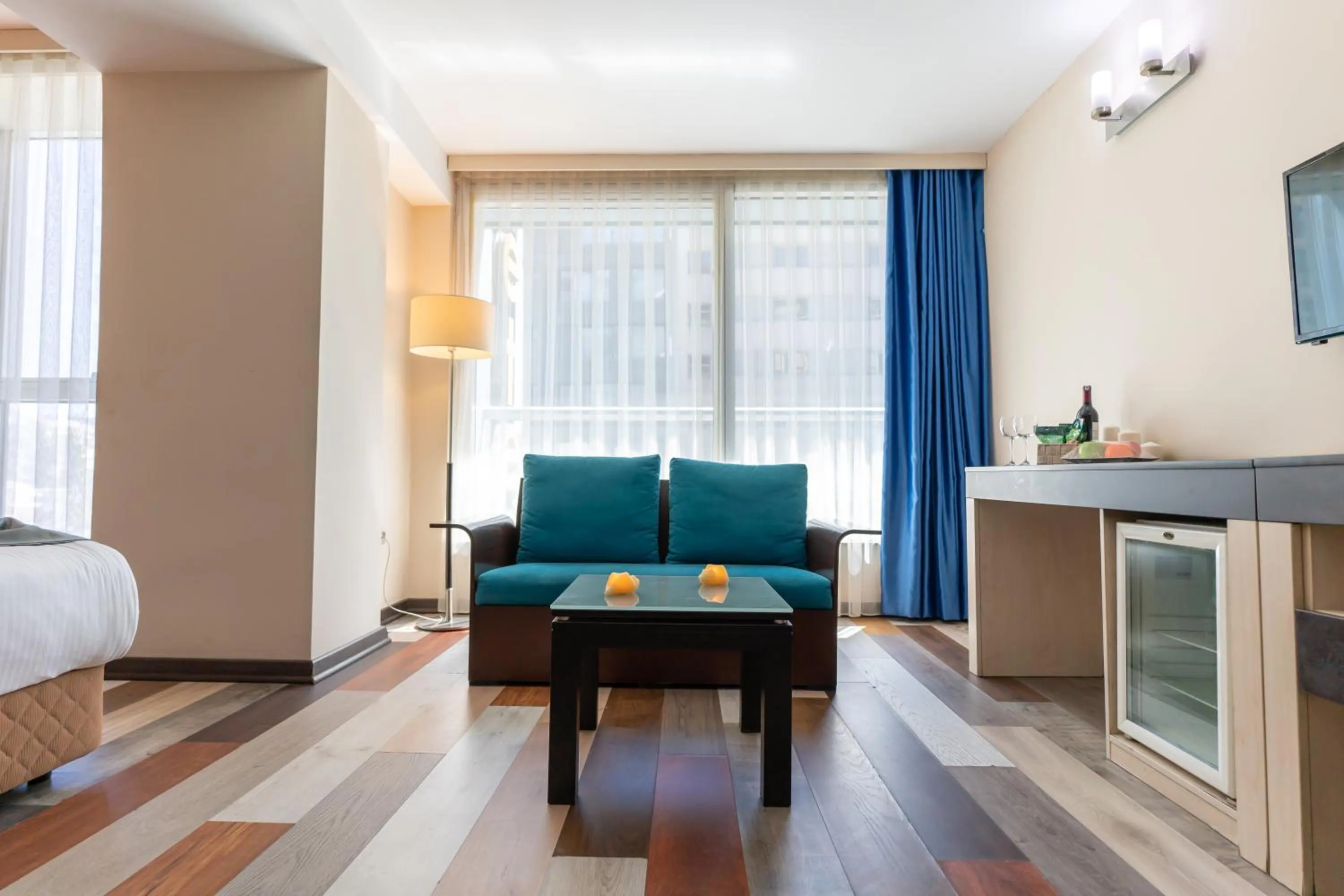 Seating area, Bed in Izmir Comfort