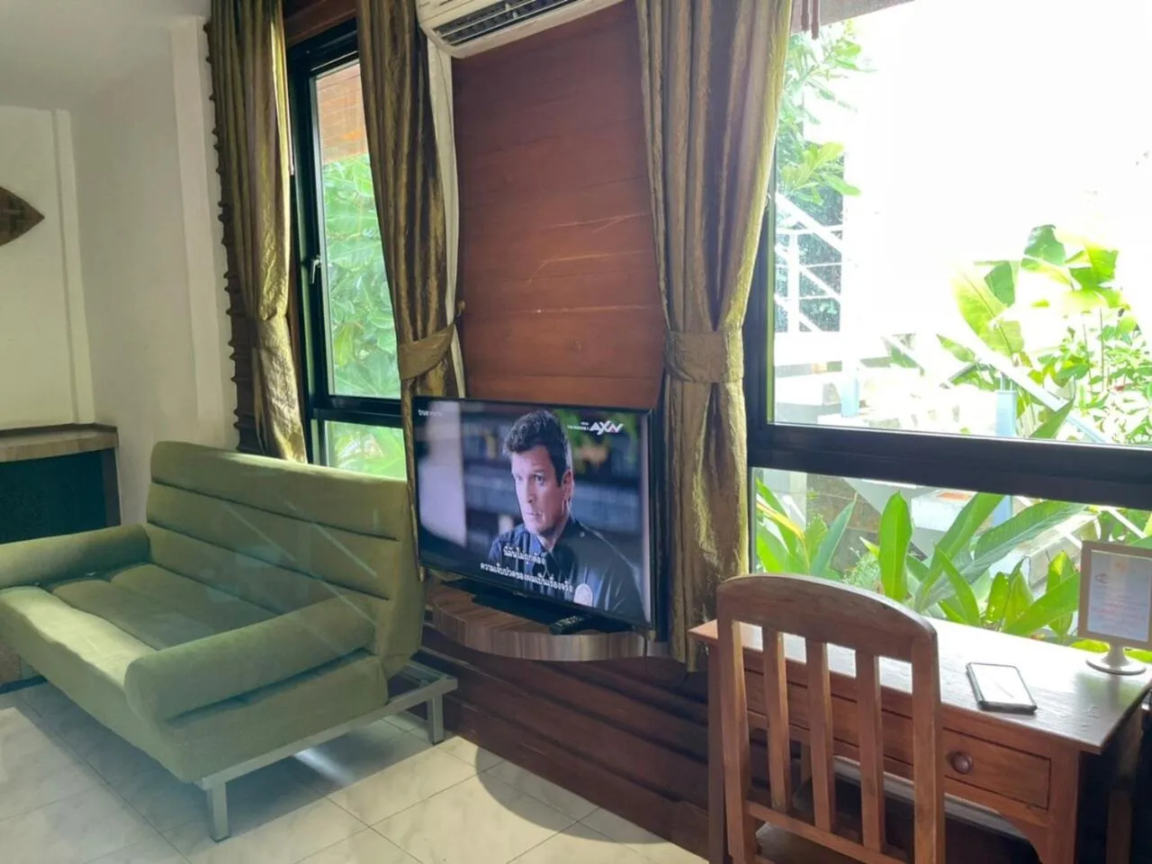 Communal lounge/ TV room in AC 2 Resort