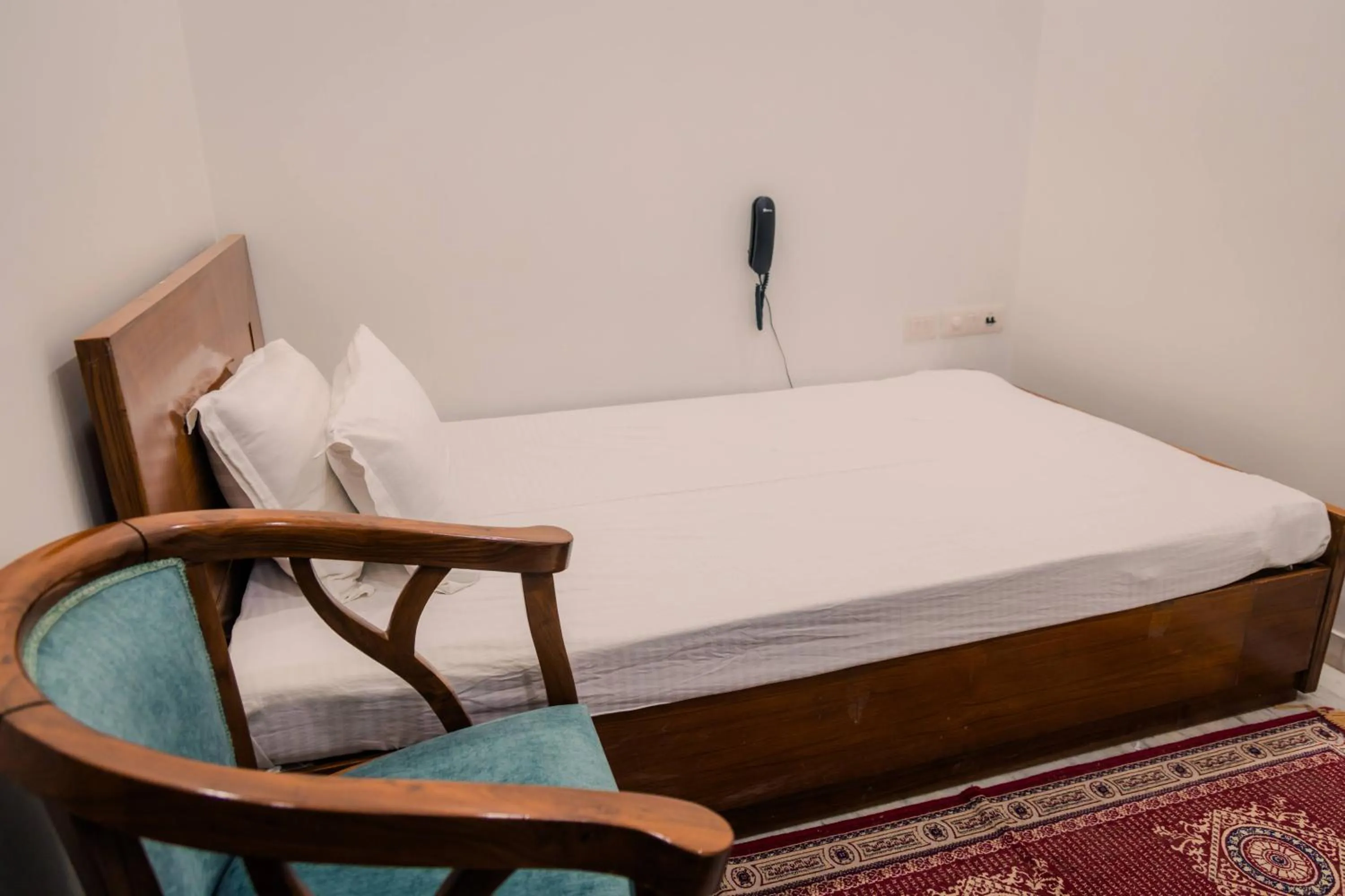 Bed in Peepal Tree Residency